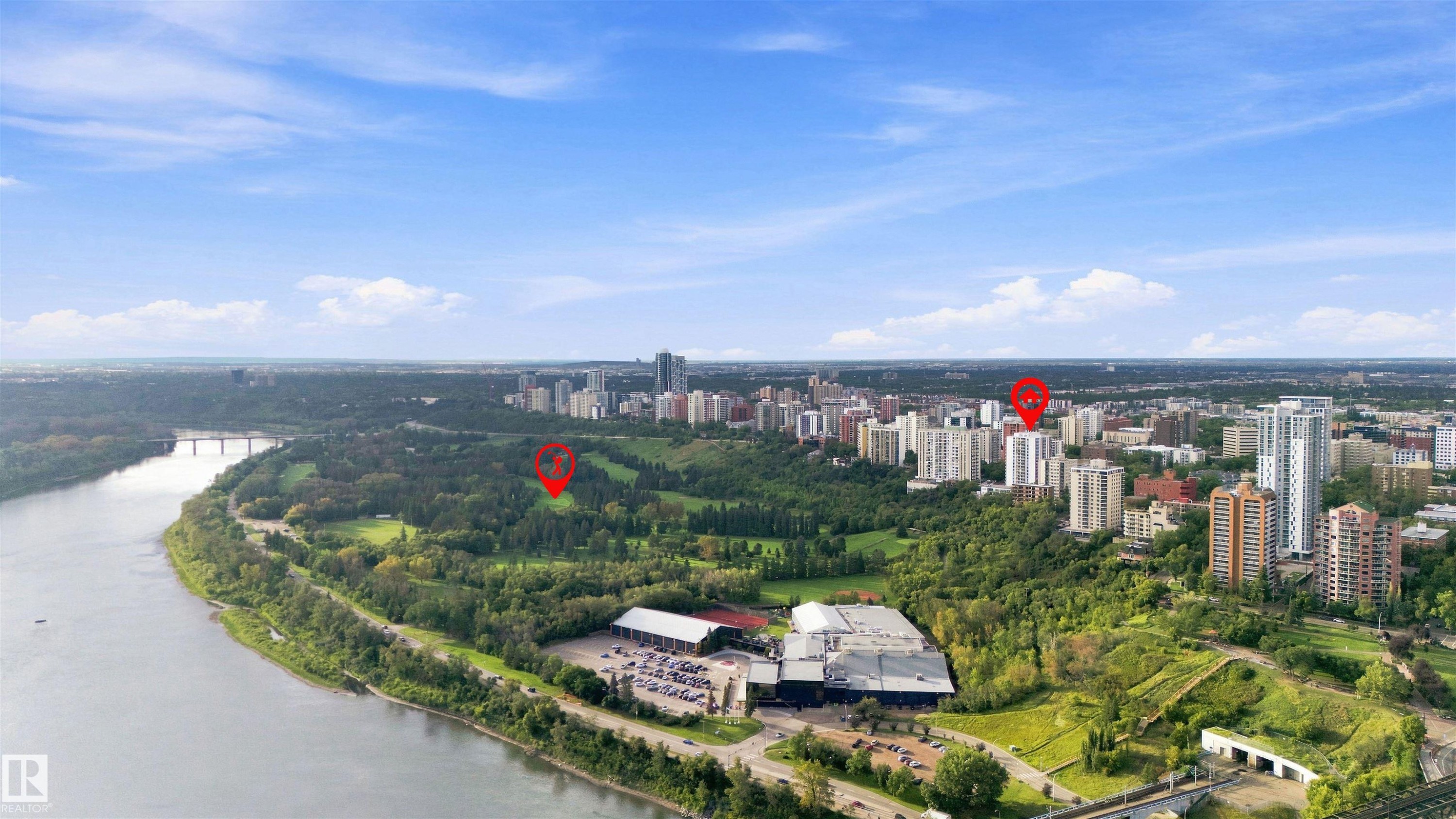 Expansive urban landscape featuring a river, significant green spaces, a prominent cityscape, and distant bridges - #1507 9835 113 St Nw, Edmonton, AB