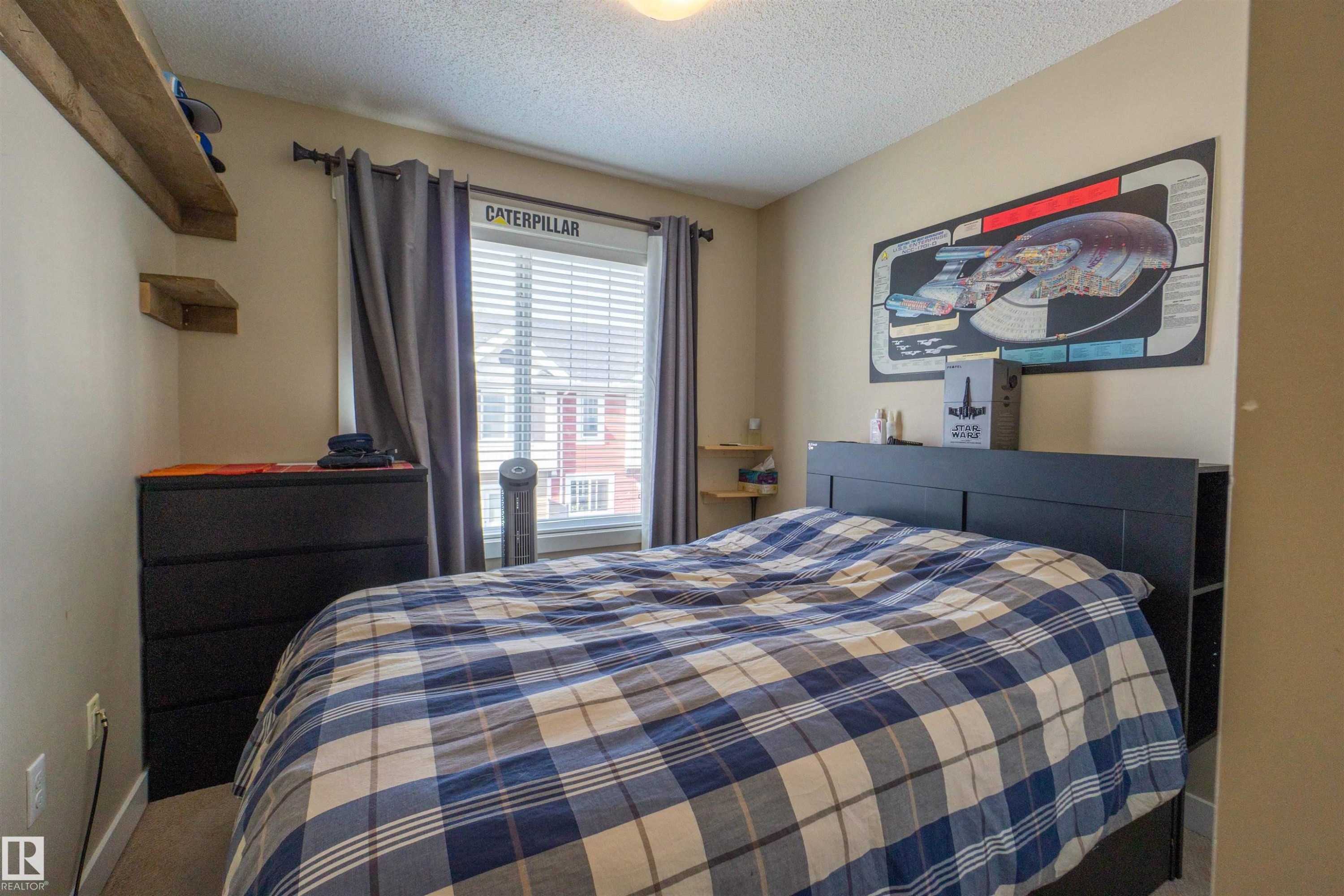 Wall-to-wall carpeting and a window with blinds and drapes - #75 8315 180 Av Nw, Edmonton, AB
