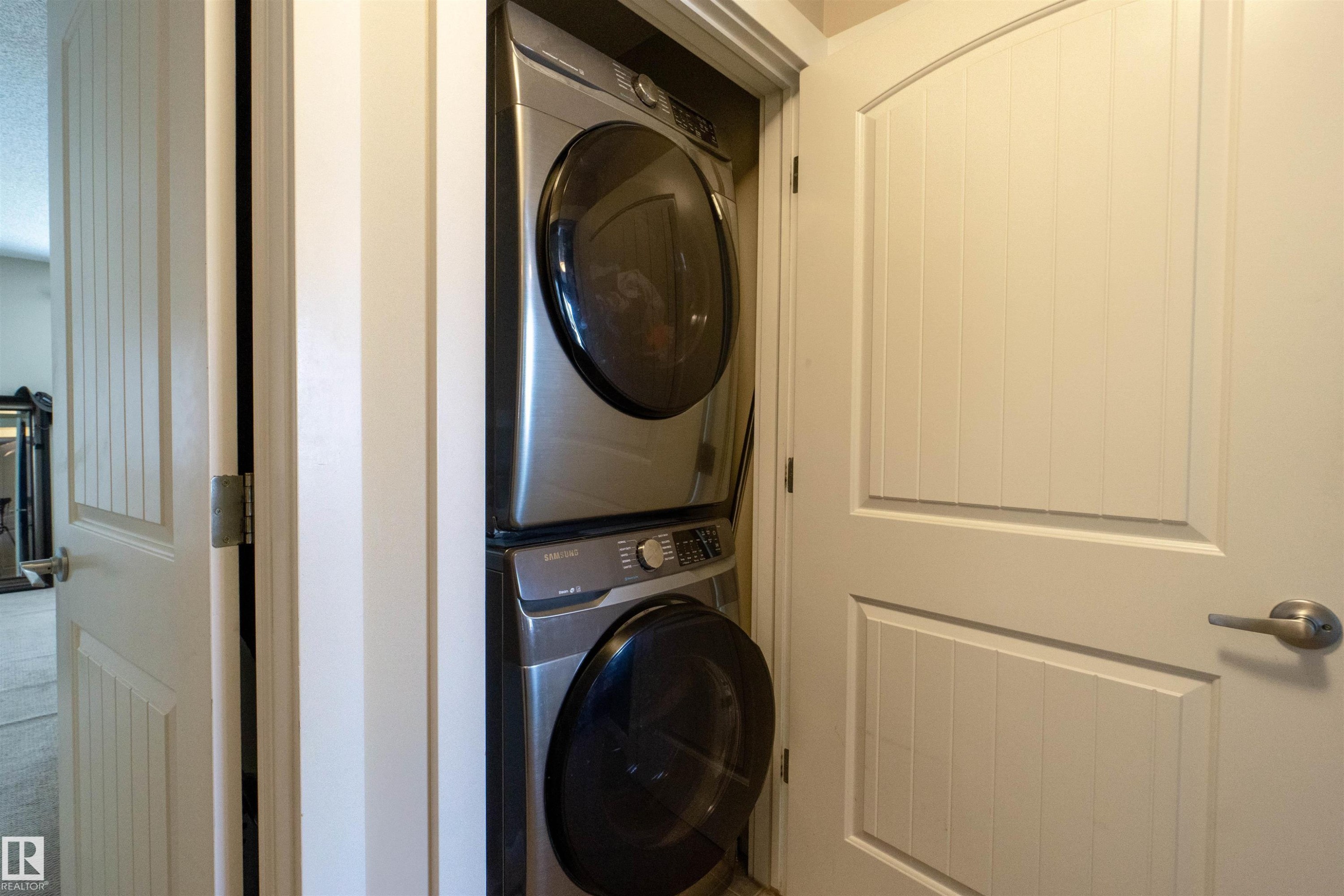 White paneled door with brushed nickel hardware - #75 8315 180 Av Nw, Edmonton, AB