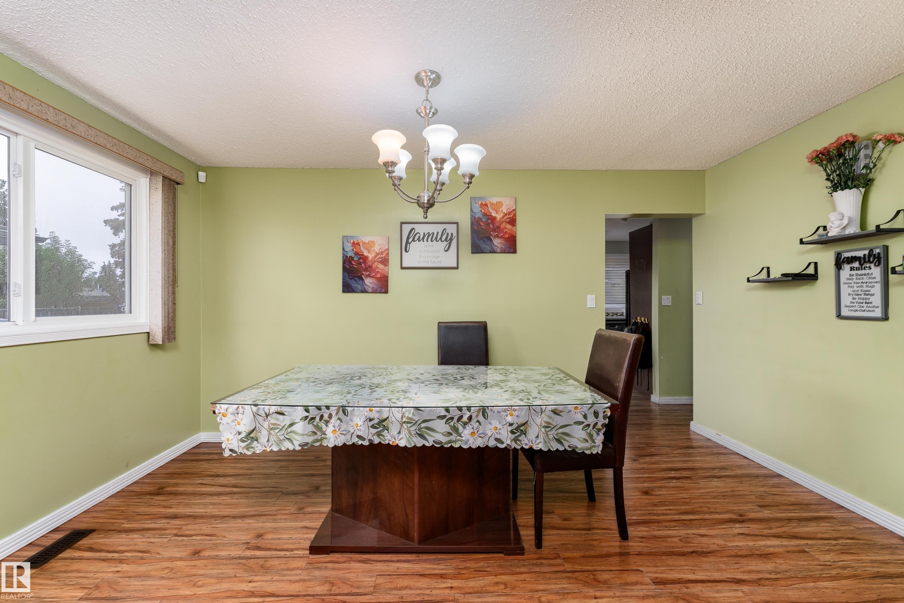 Wood-finish flooring with white trim - 17928 93 Ave Nw, Edmonton, AB