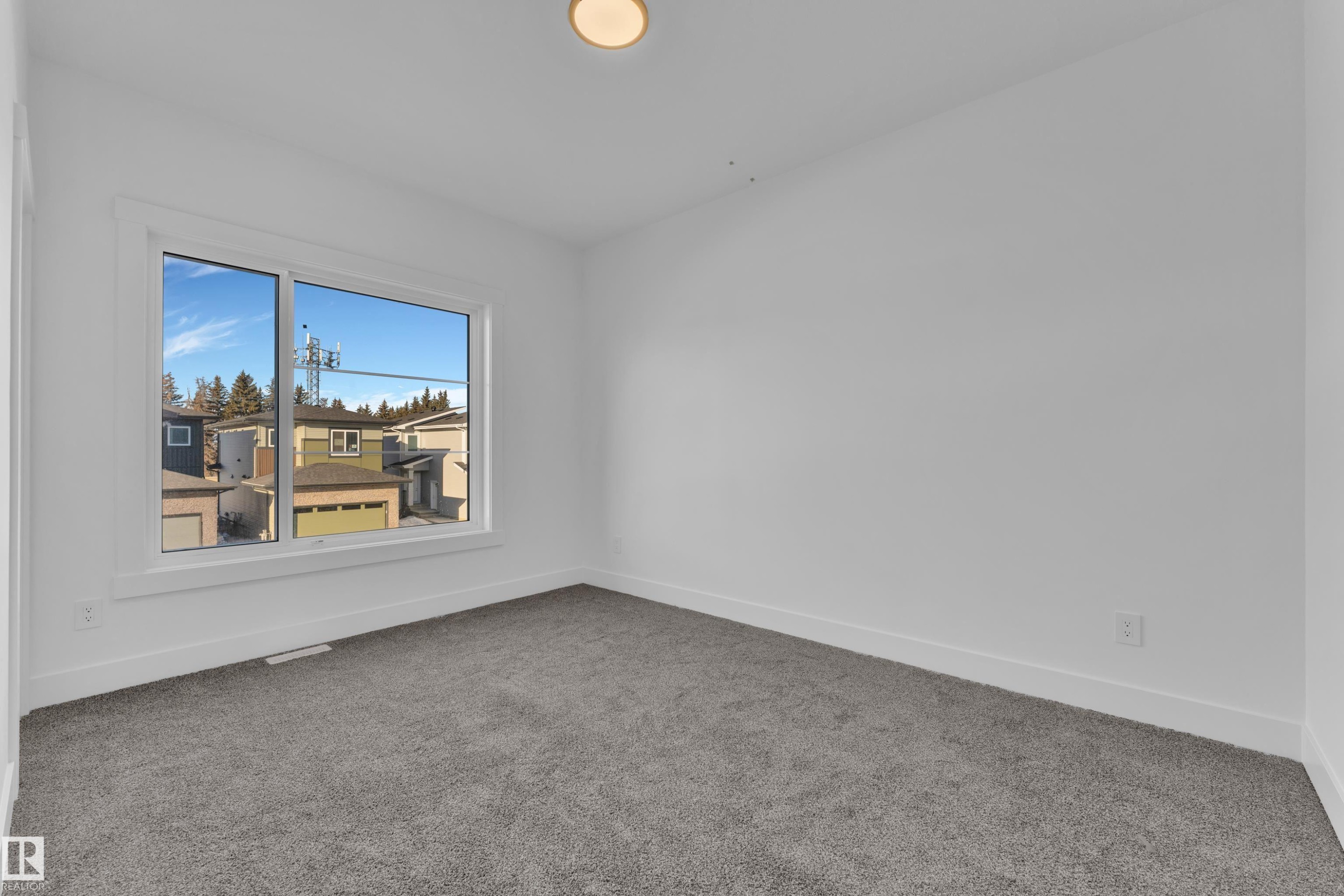 Neutral wall finish, recessed ceiling lighting, and gray carpeting - 226 Linden Loop, Leduc, AB