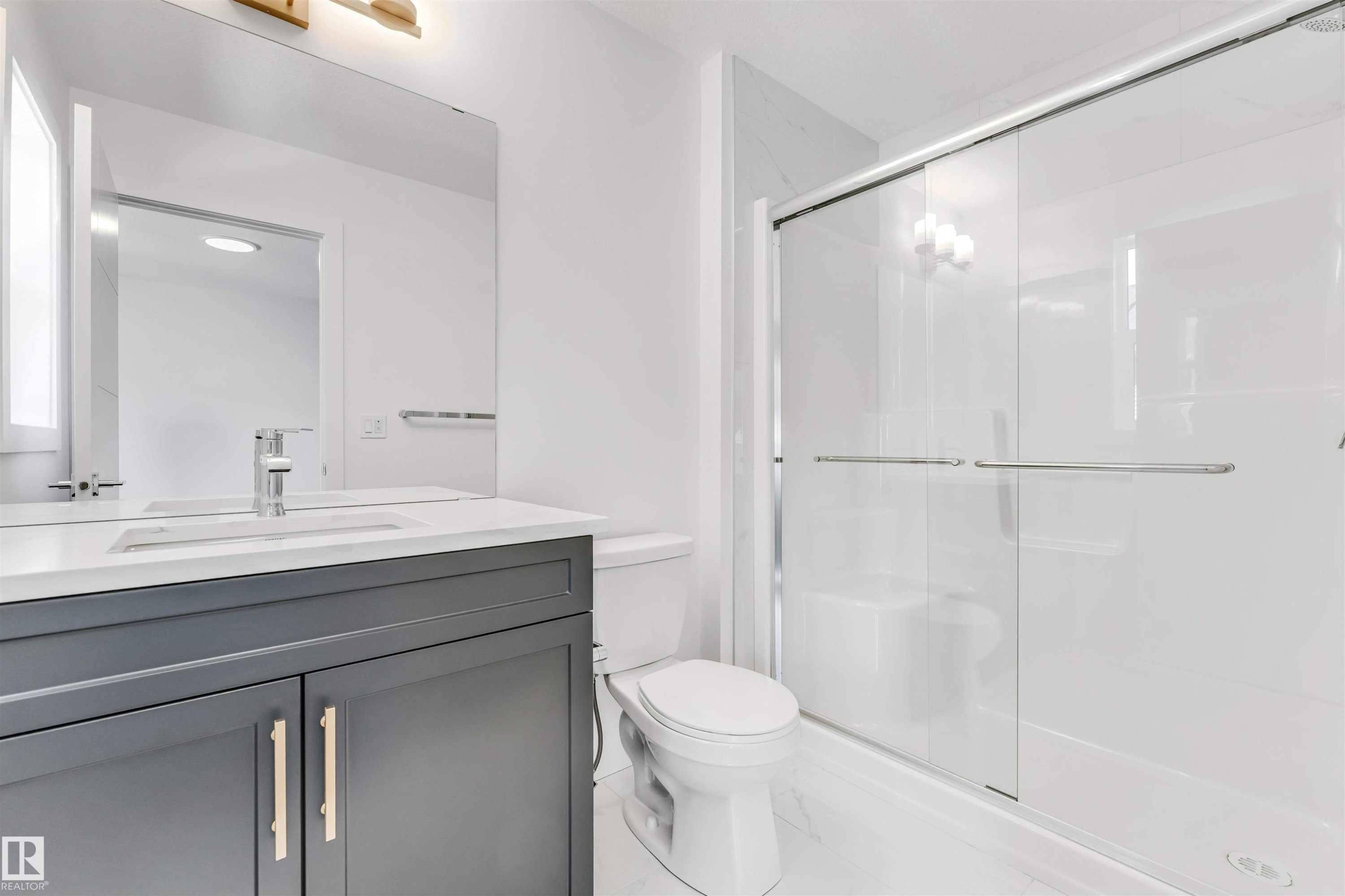 Modern vanity with a light countertop and chrome faucet - #48 710 Mattson Dr Sw Sw, Edmonton, AB