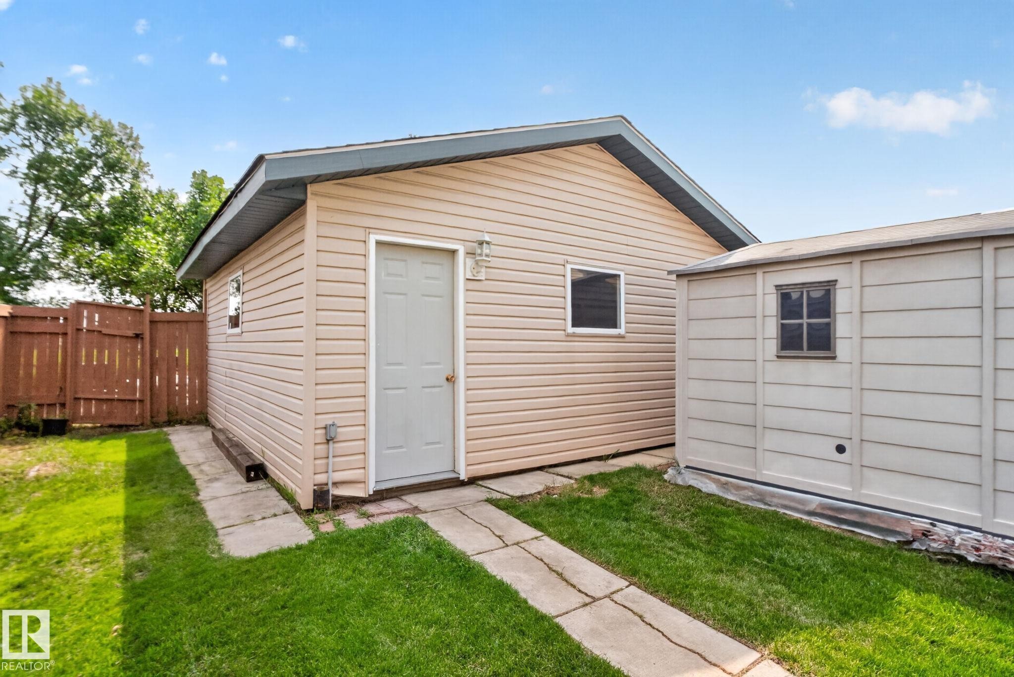 Detached structure with horizontal siding, a side entry door, and a single window - 8923 173 Avenue Nw, Edmonton, AB
