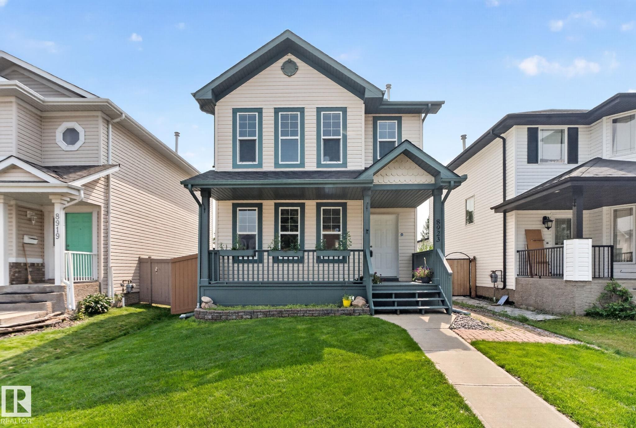 Two-story home with horizontal siding and a covered front porch - 8923 173 Avenue Nw, Edmonton, AB