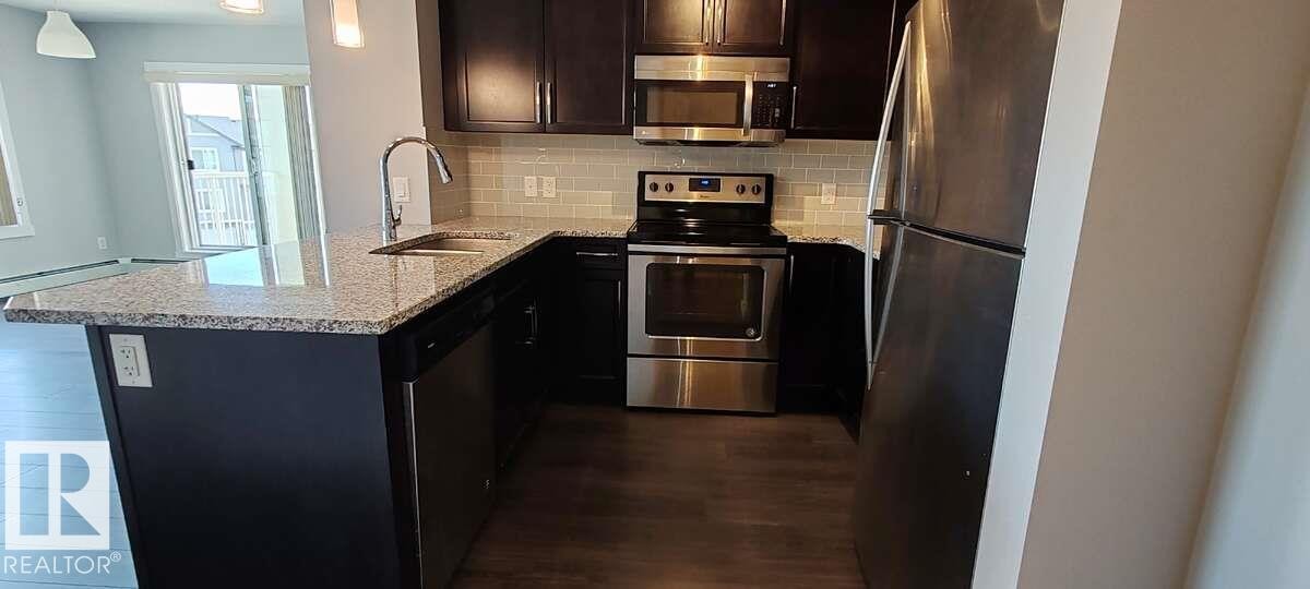 #302 3670 139 Av Nw, Edmonton, AB - Indoor Photo Showing Kitchen With Upgraded Kitchen