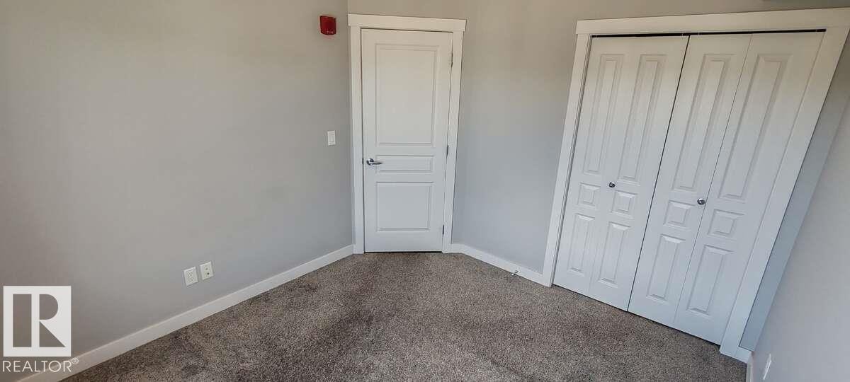 #302 3670 139 Av Nw, Edmonton, AB - Indoor Photo Showing Other Room
