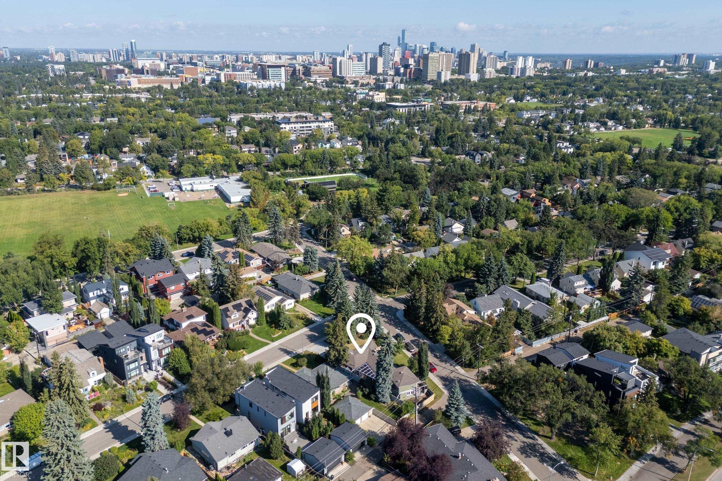 Aerial perspective of a verdant neighborhood with a distant cityscape - 11603 72 Avenue Nw, Edmonton, AB