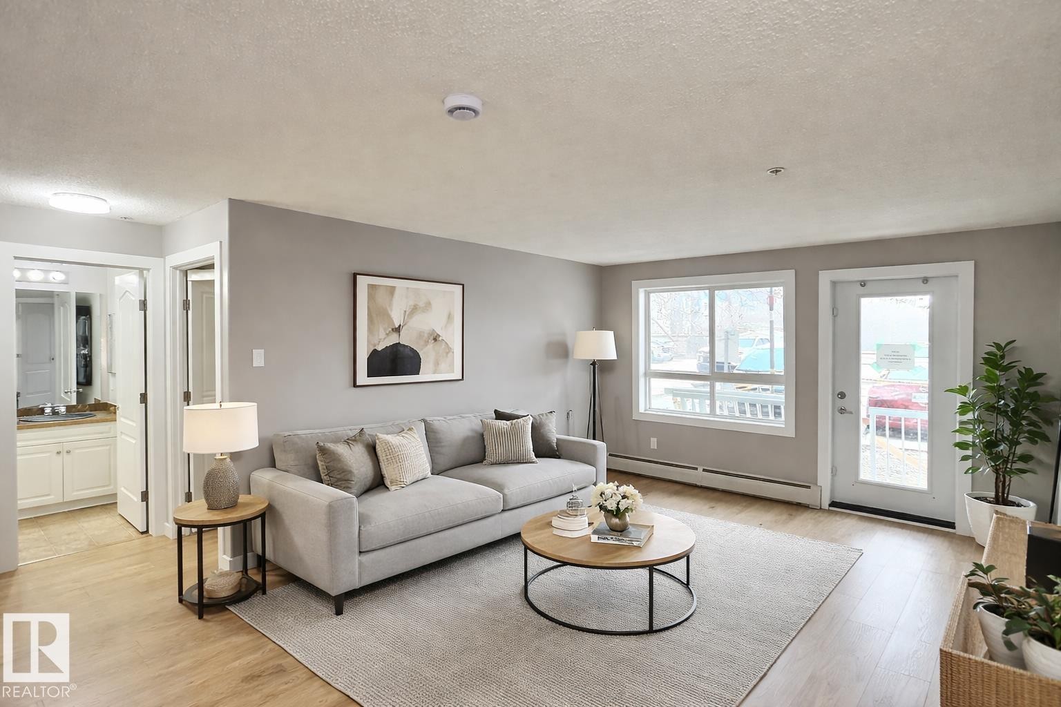 #103 5350 199 St Nw, Edmonton, AB - Indoor Photo Showing Living Room