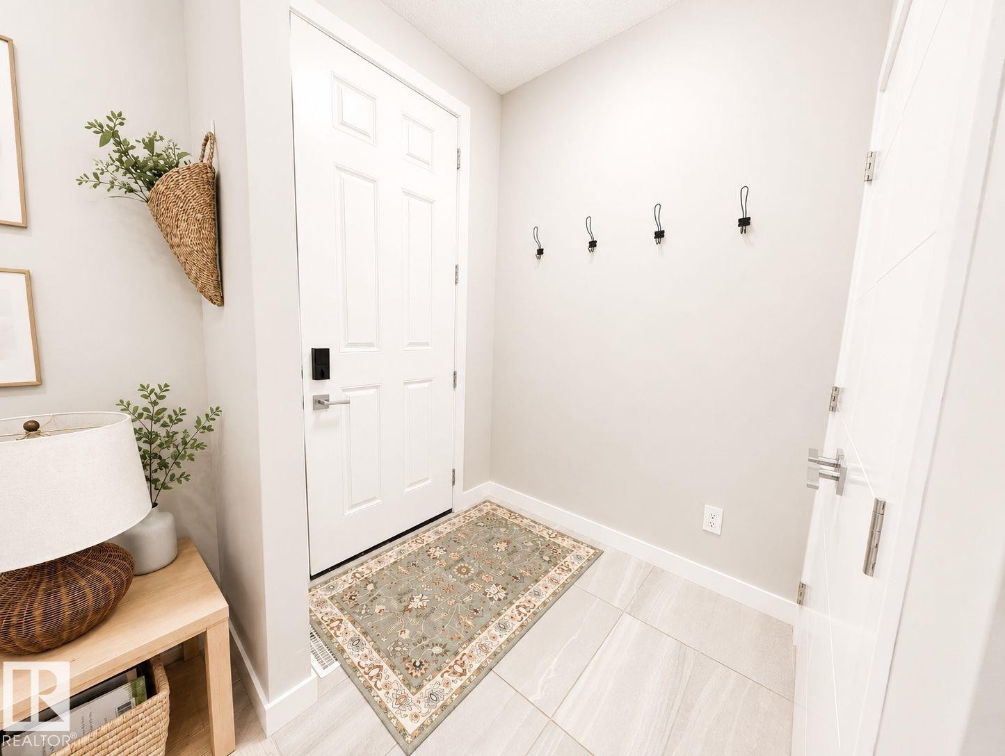 White paneled door with smart lock entry - 10516 76 Street Nw, Edmonton, AB