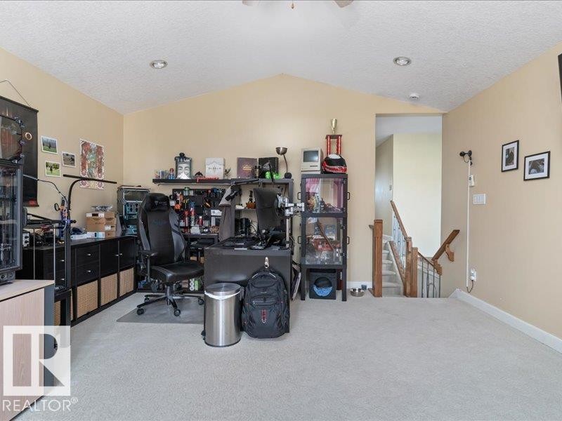 Vaulted ceiling with recessed lighting - 496 Ravine Court, Devon, AB