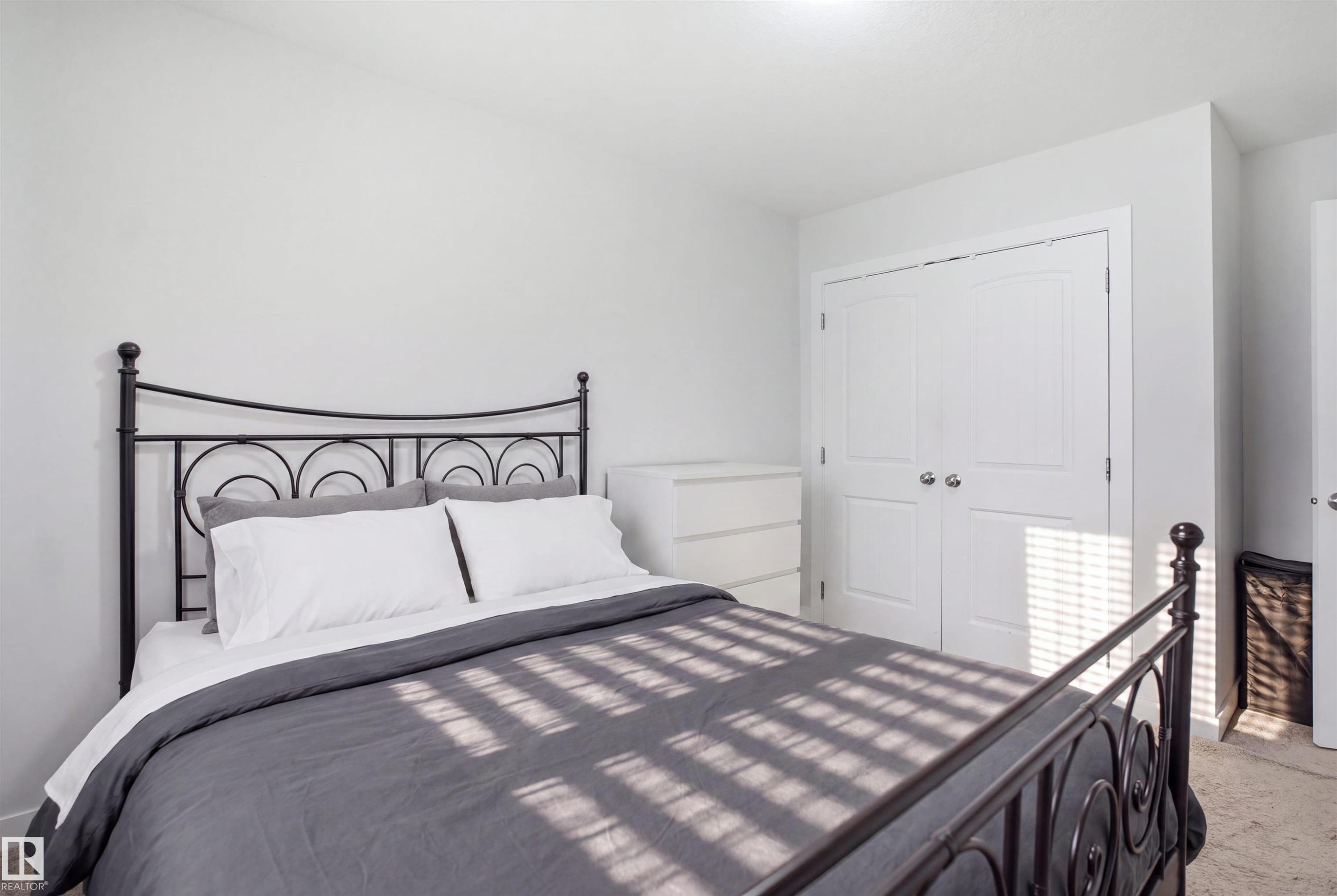 White walls with a textured finish, recessed lighting, and a bi-fold closet door - #22 723 172 Street Sw, Edmonton, AB