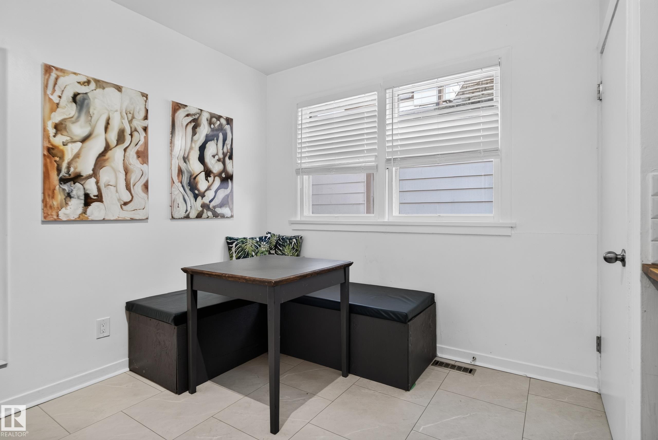 White walls with a window featuring horizontal blinds, and light-toned tile flooring - 11406 83 Street Nw, Edmonton, AB