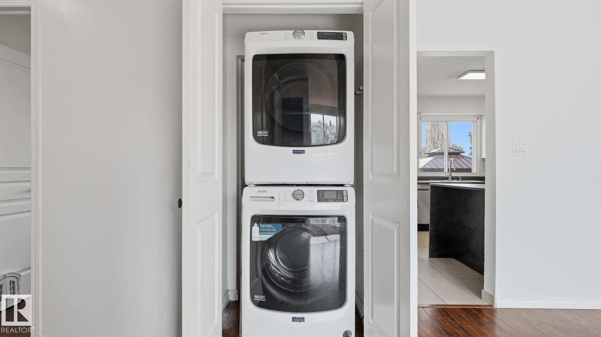Stackable washer and dryer within a dedicated closet - 12208 146 Avenue Nw, Edmonton, AB