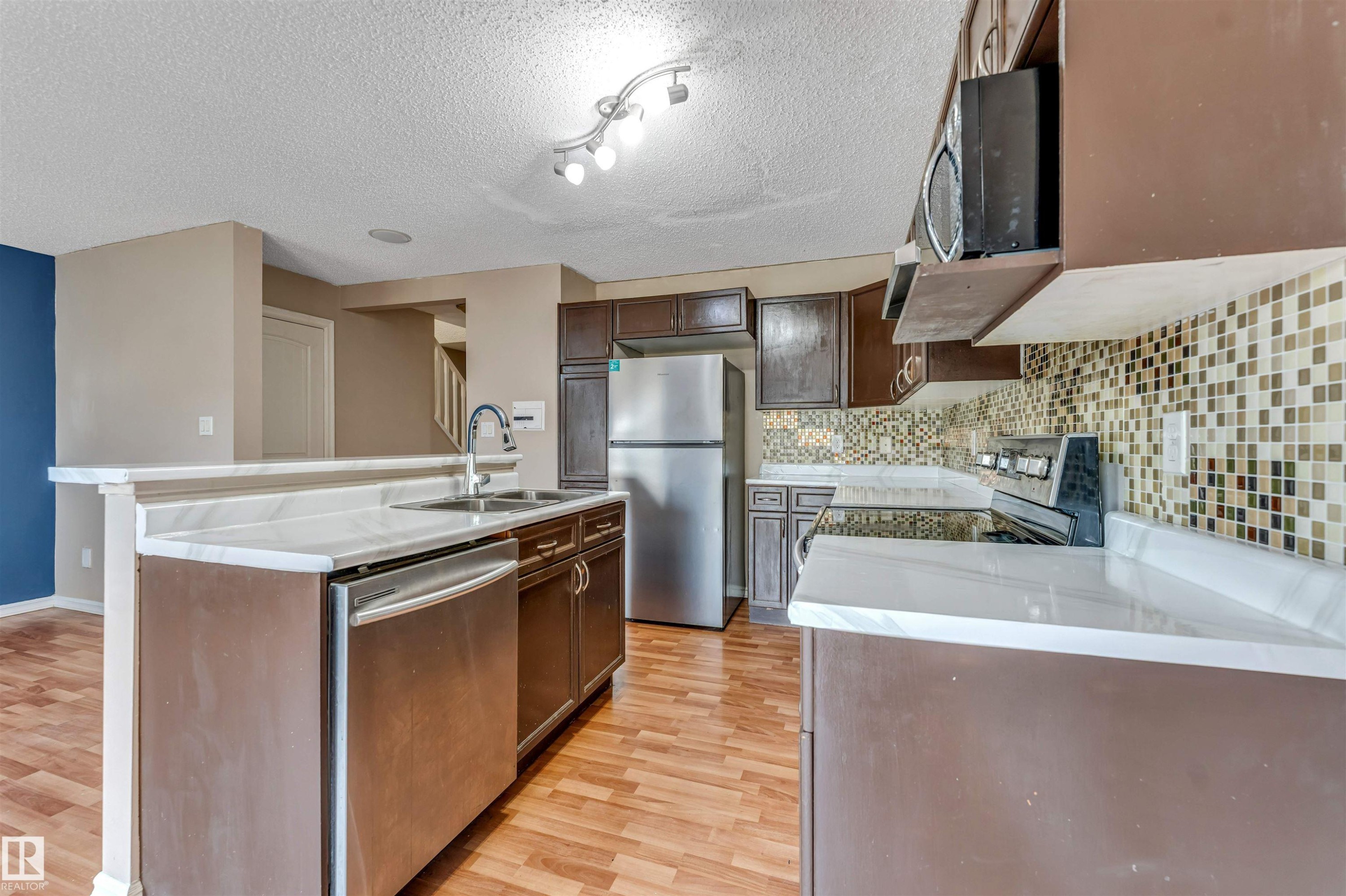 7743 8 Avenue Sw, Edmonton, AB - Indoor Photo Showing Kitchen With Double Sink