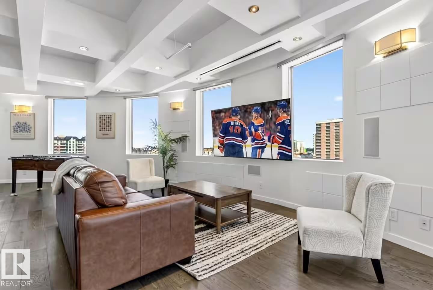Hardwood flooring, recessed lighting, and multiple windows - #701 10105 109 St Nw, Edmonton, AB