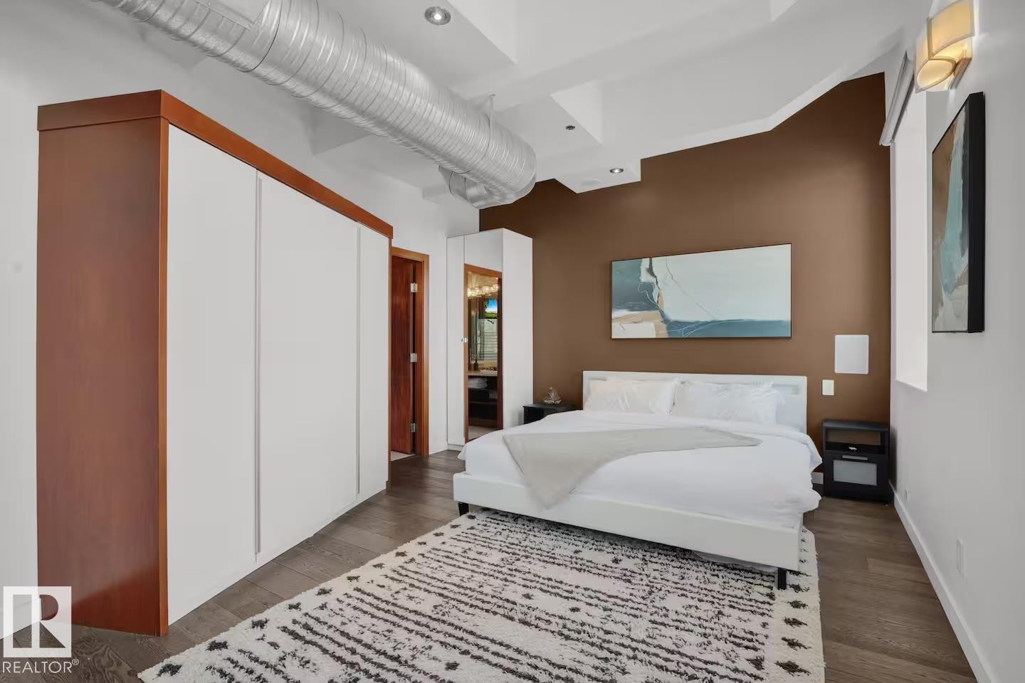 Wood-finish flooring with recessed lighting - #701 10105 109 St Nw, Edmonton, AB