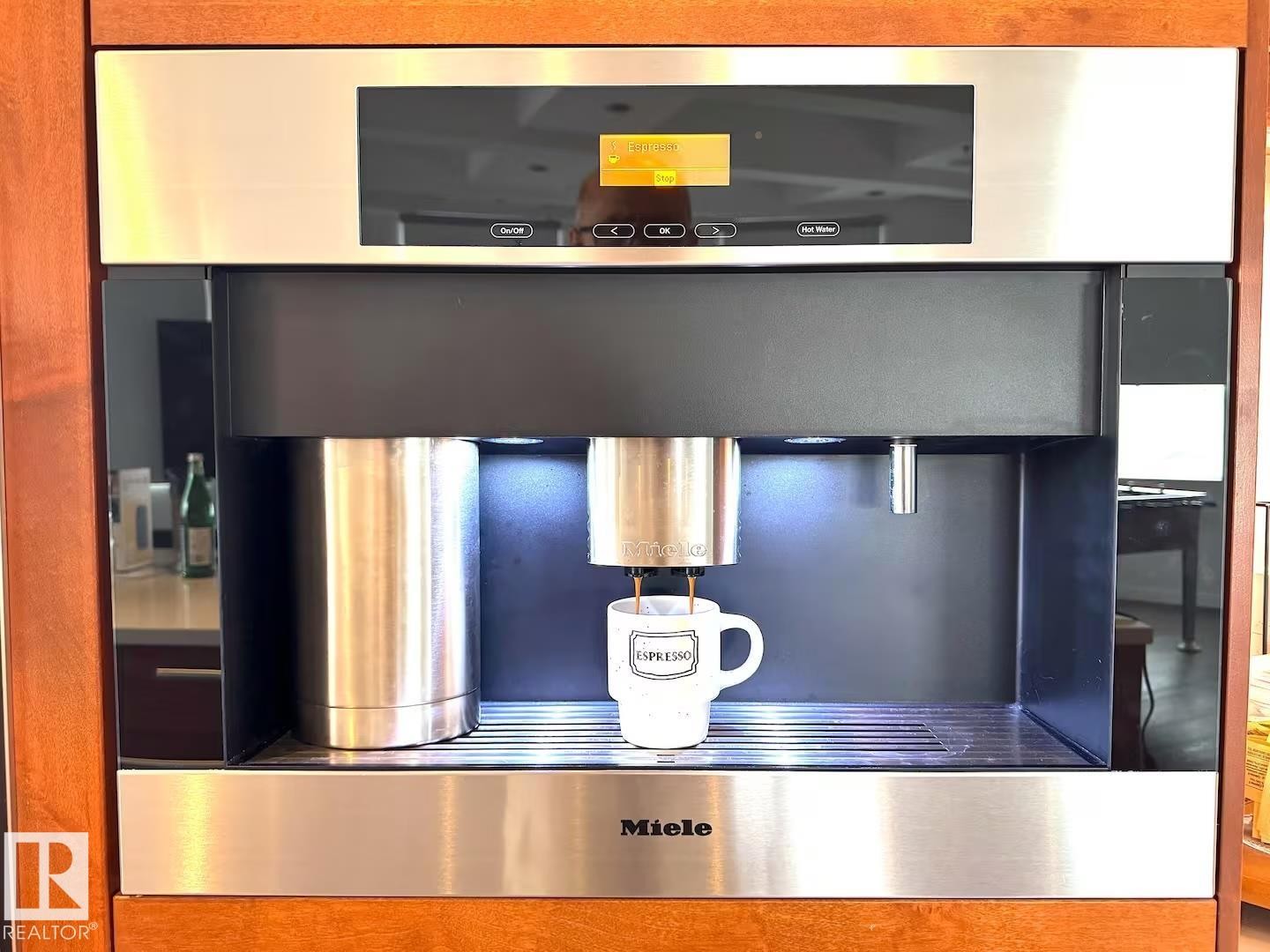 Built-in Miele coffee system with stainless steel accents and a digital display - #701 10105 109 St Nw, Edmonton, AB