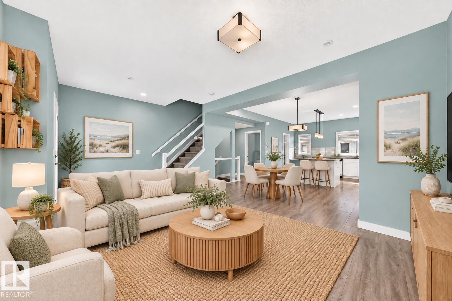 Open concept living area with wood-finish flooring, recessed lighting, and a modern ceiling fixture - #56 804 Welsh Dr Sw, Edmonton, AB