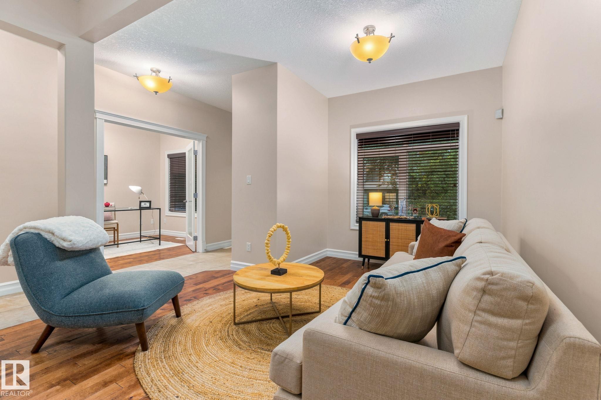 Wood-finish flooring, recessed entryways, and ceiling-mounted light fixtures - 10143 123 Street Nw, Edmonton, AB