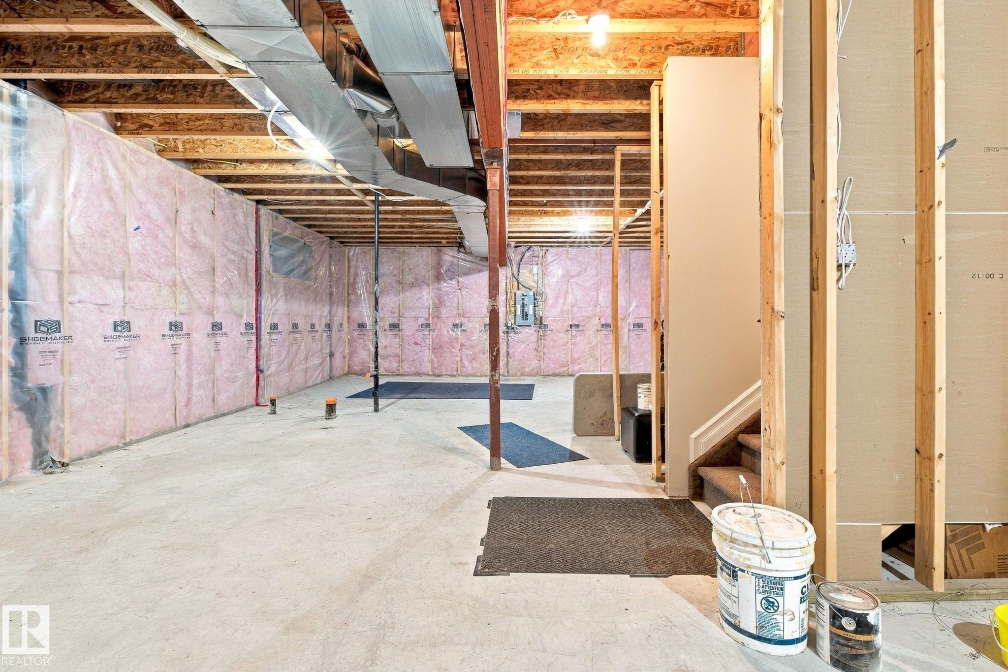 Unfinished basement offering exposed wood framing, concrete flooring, and visible insulation - 10143 123 Street Nw, Edmonton, AB