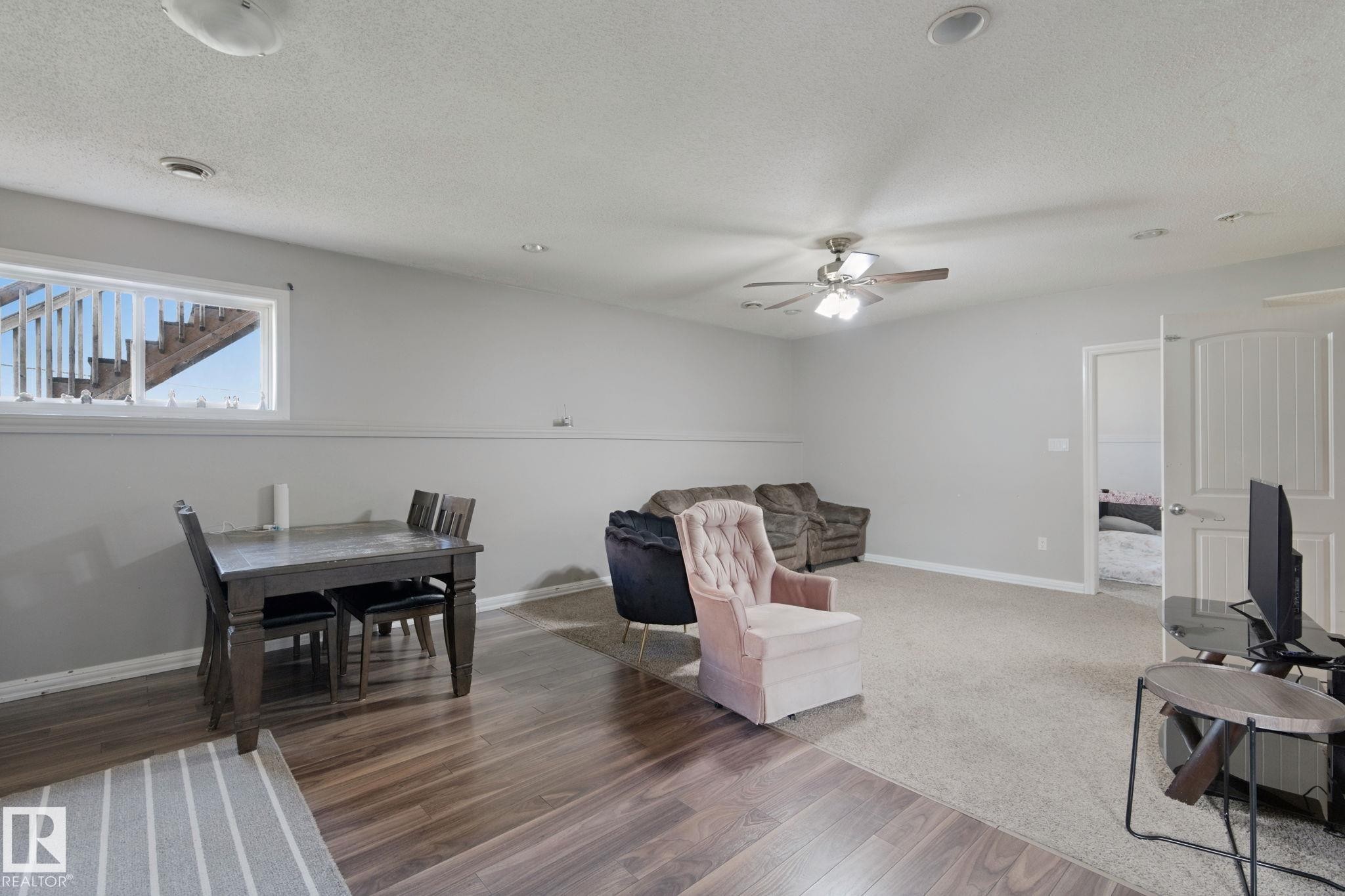 Recessed lighting, ceiling fan, wood-finish flooring, carpeted area, and white paneled interior door - 16807 78 Street Nw, Edmonton, AB