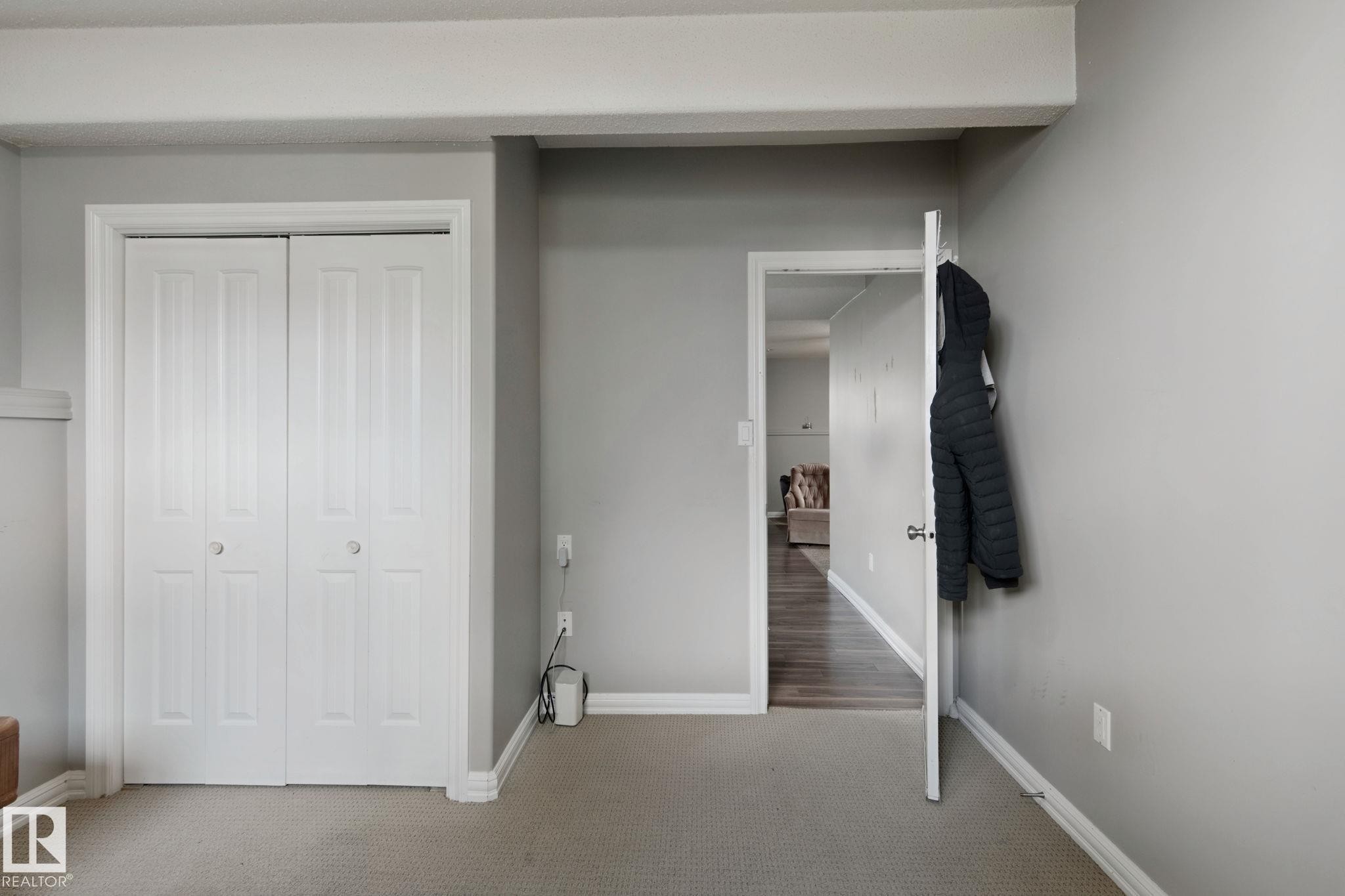 Neutral gray wall color complemented by white trim - 16807 78 Street Nw, Edmonton, AB