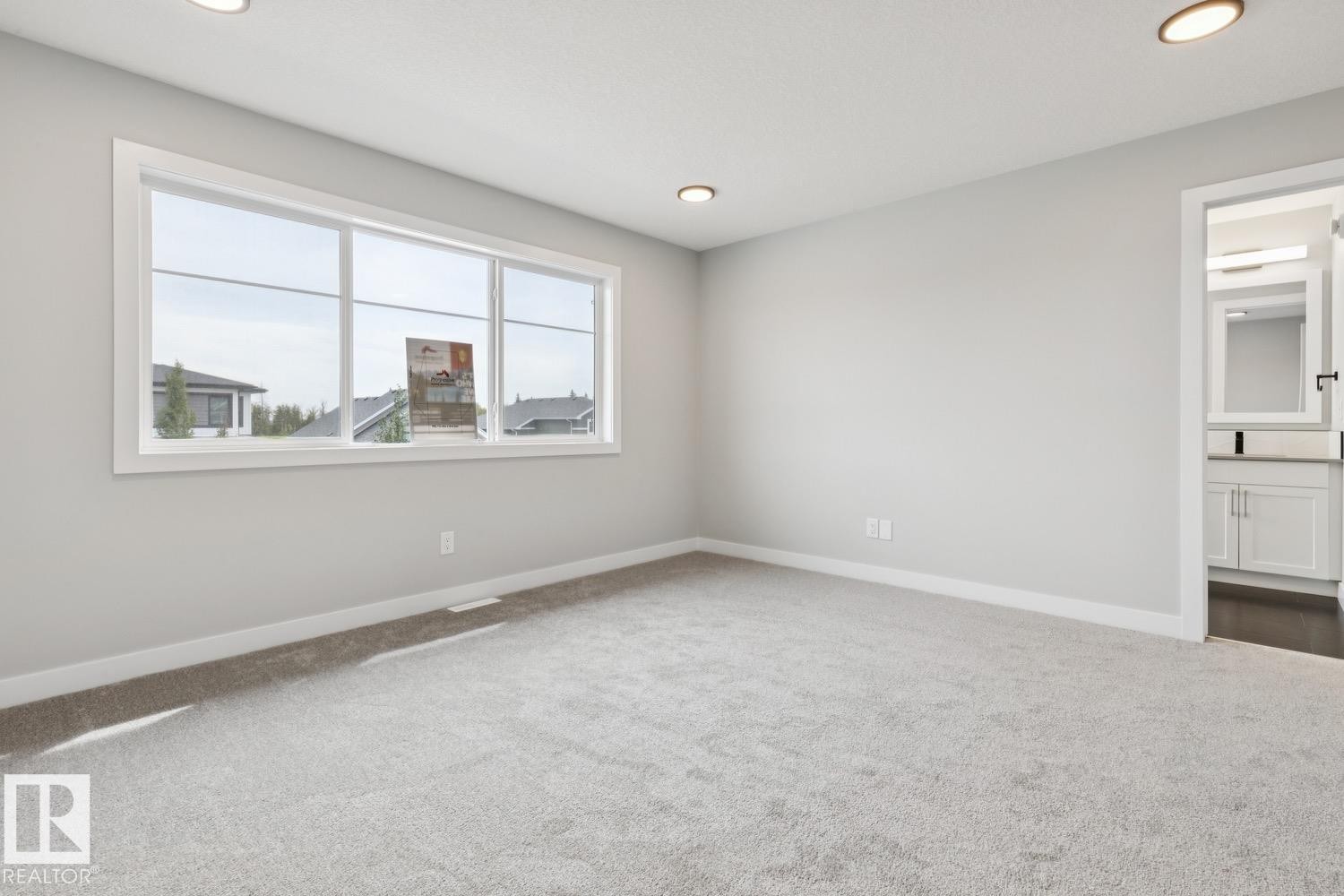 Wall-to-wall carpeting and neutral wall tones - 72 Maple Crescent, Gibbons, AB