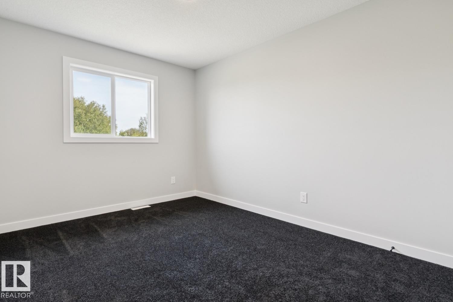 White walls with dark gray carpeting - 36 Maple Crescent, Gibbons, AB
