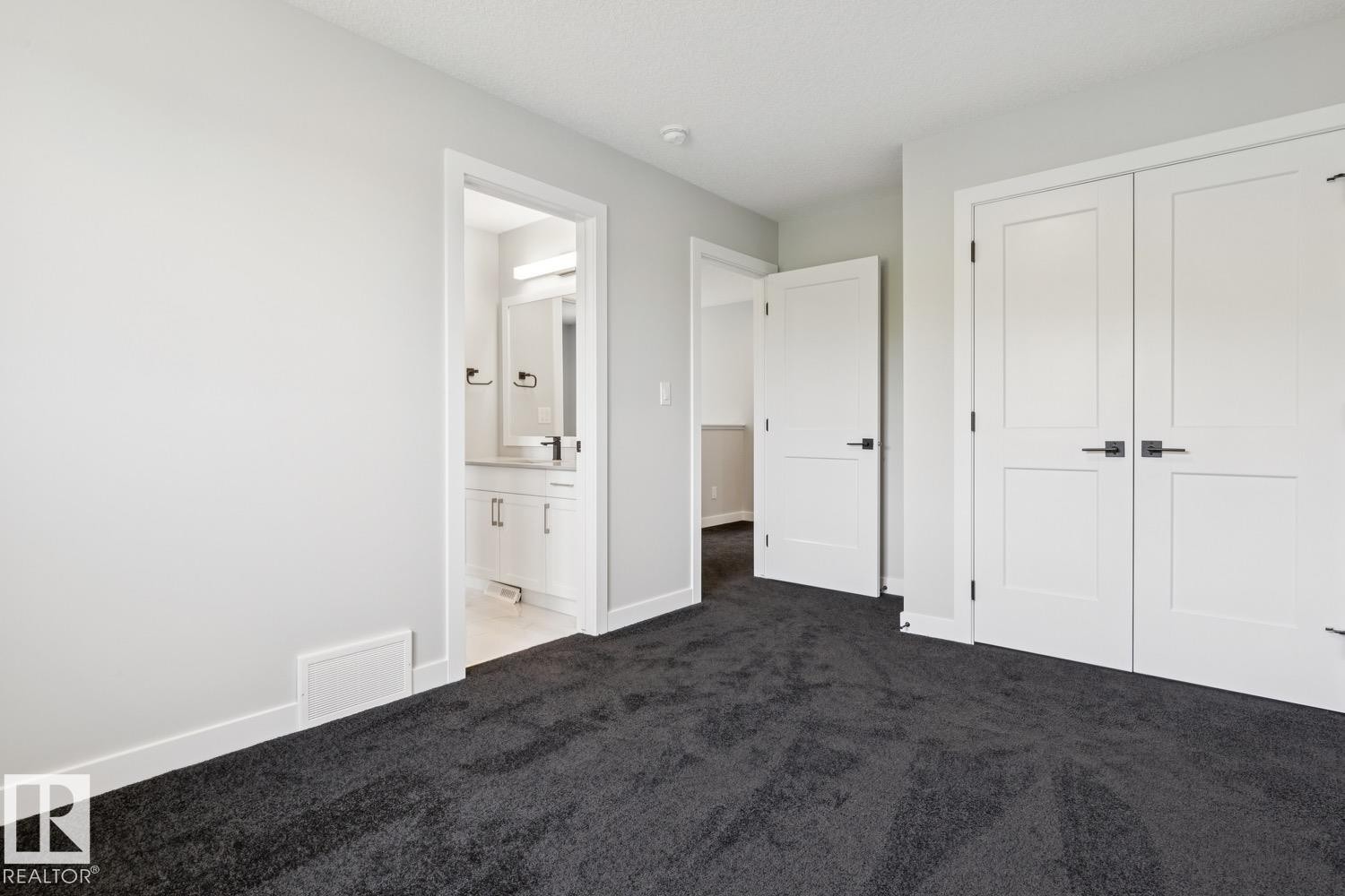 Gray carpeting with white trim - 36 Maple Crescent, Gibbons, AB