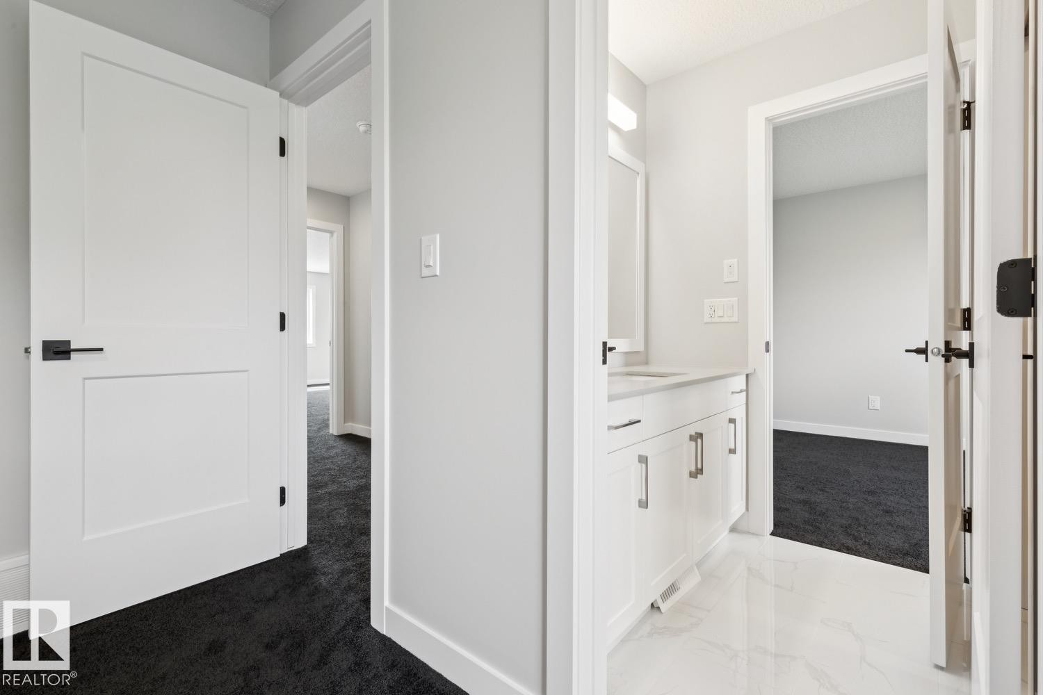 White vanity with a light countertop and polished hardware - 36 Maple Crescent, Gibbons, AB