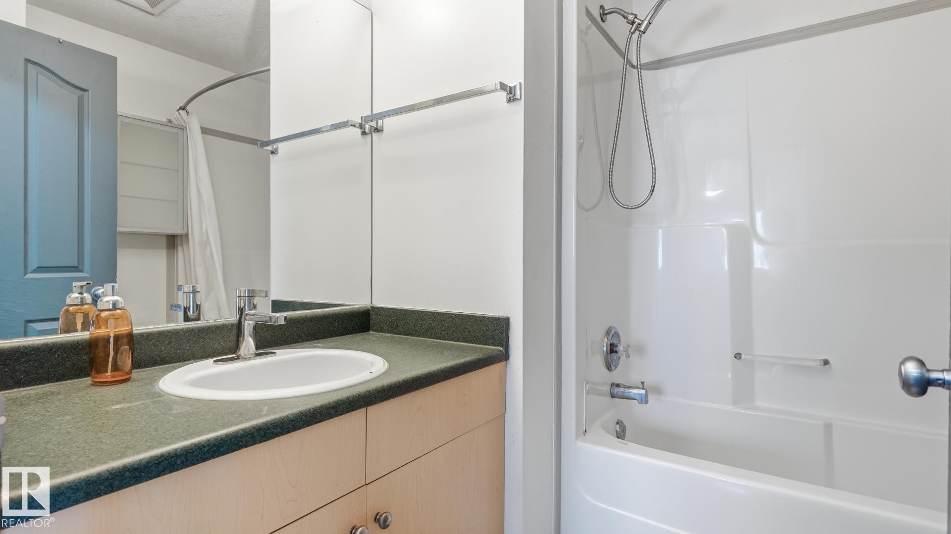 Vanity with an integrated sink and laminate countertop - 2117 36 Avenue Nw, Edmonton, AB