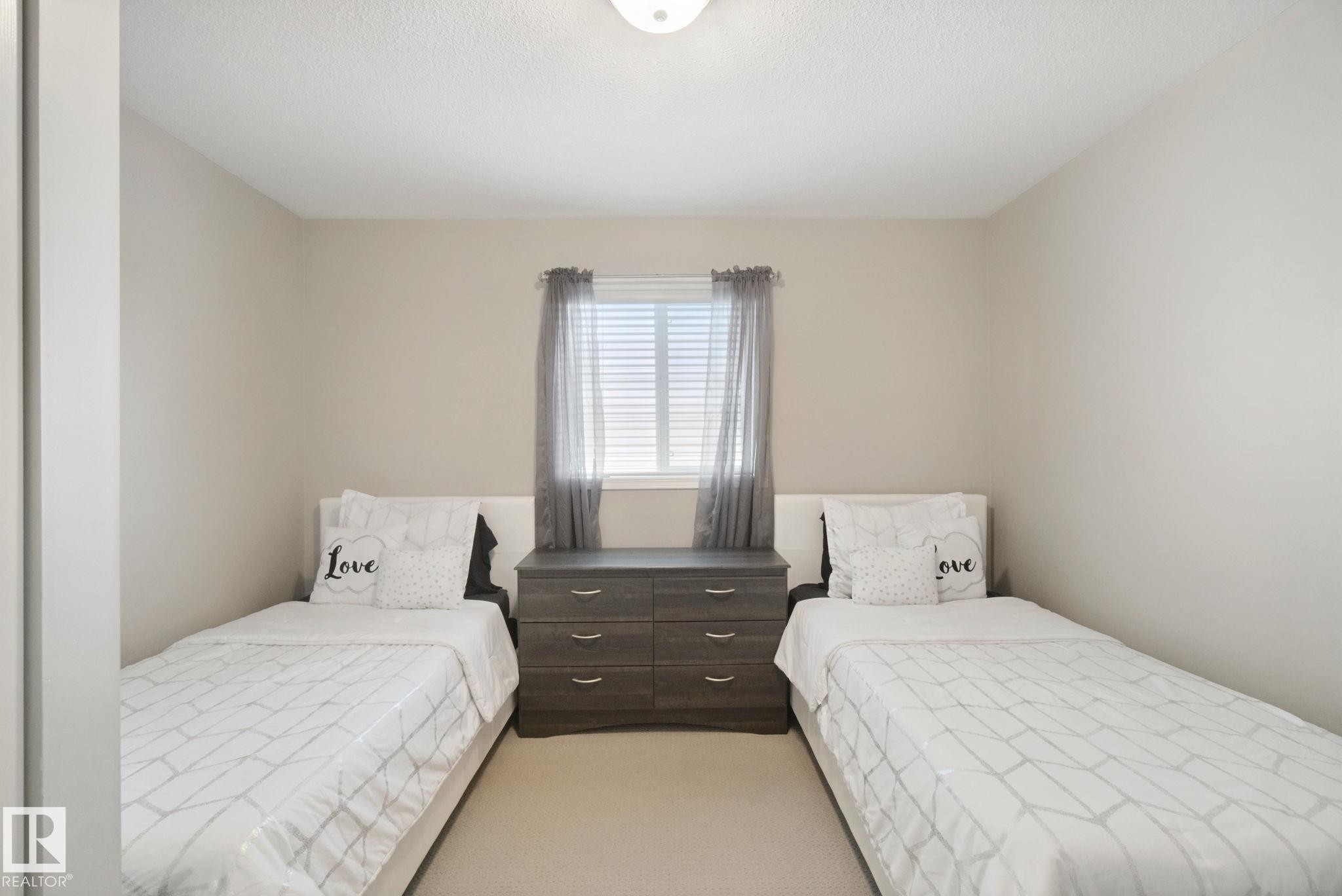 Neutral wall tones, recessed ceiling light, and window with blinds - 13912 156 Avenue Nw, Edmonton, AB