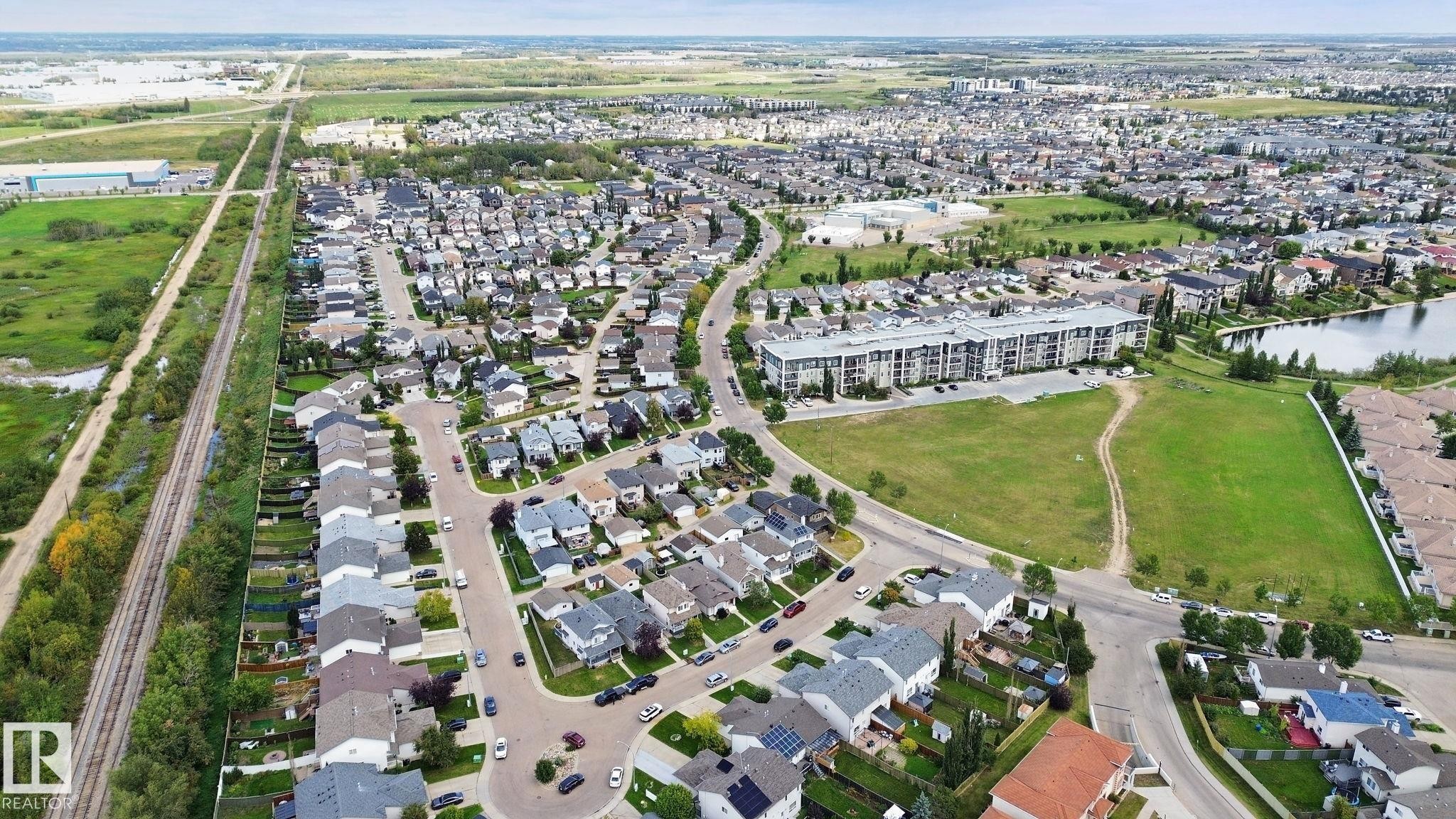 Residential neighborhood with varying housing styles, established streets, and mature landscaping - 13912 156 Avenue Nw, Edmonton, AB
