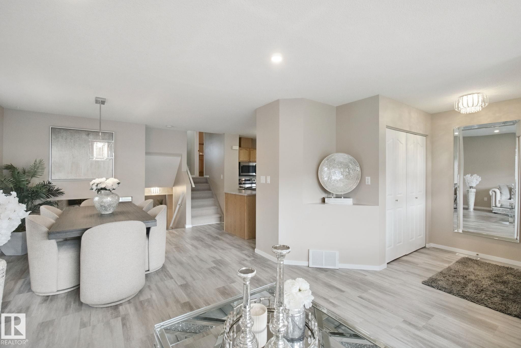 Wood-finish flooring throughout the main level - 13912 156 Avenue Nw, Edmonton, AB