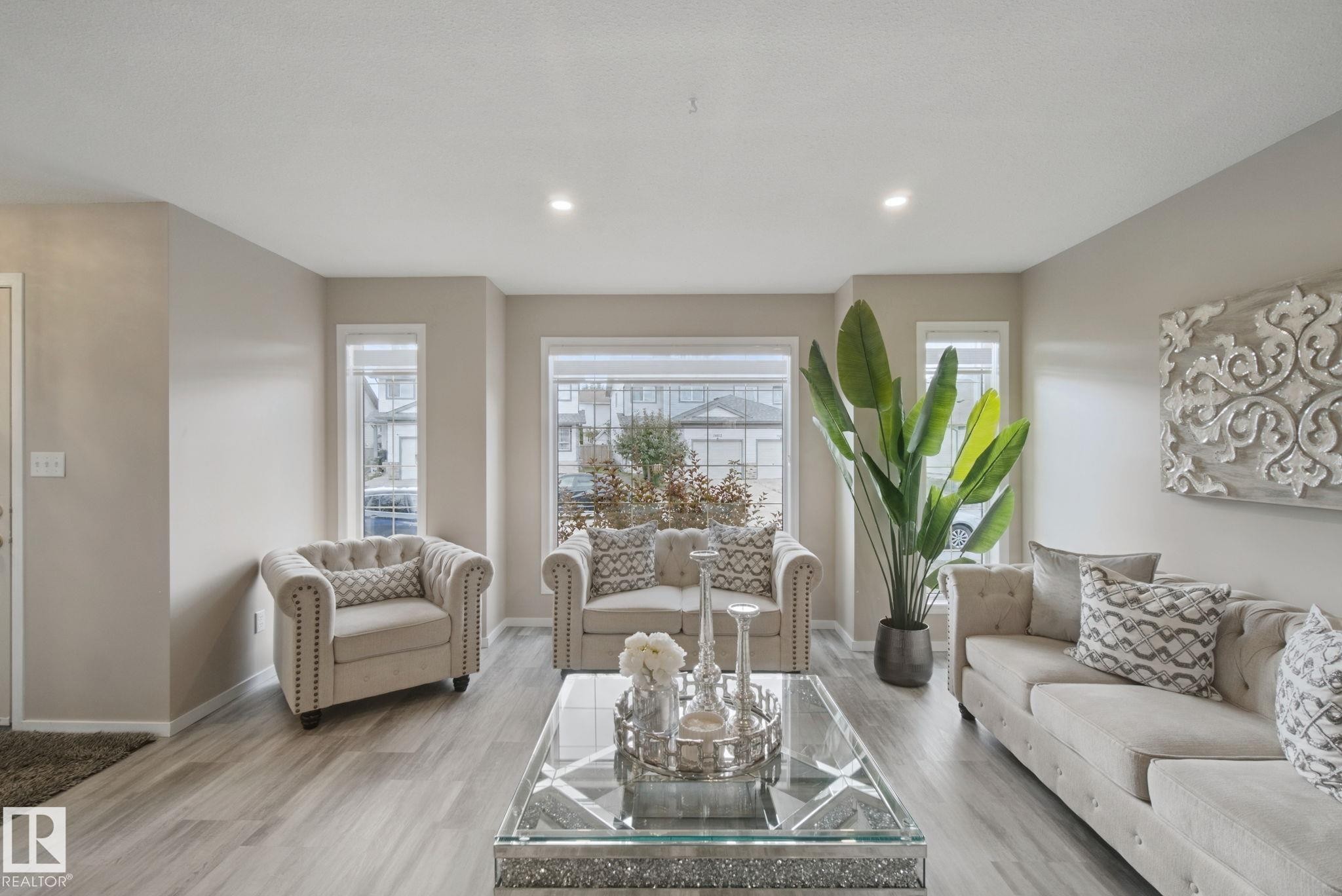 Recessed lighting illumination, light wood-finish flooring, and multiple windows - 13912 156 Avenue Nw, Edmonton, AB