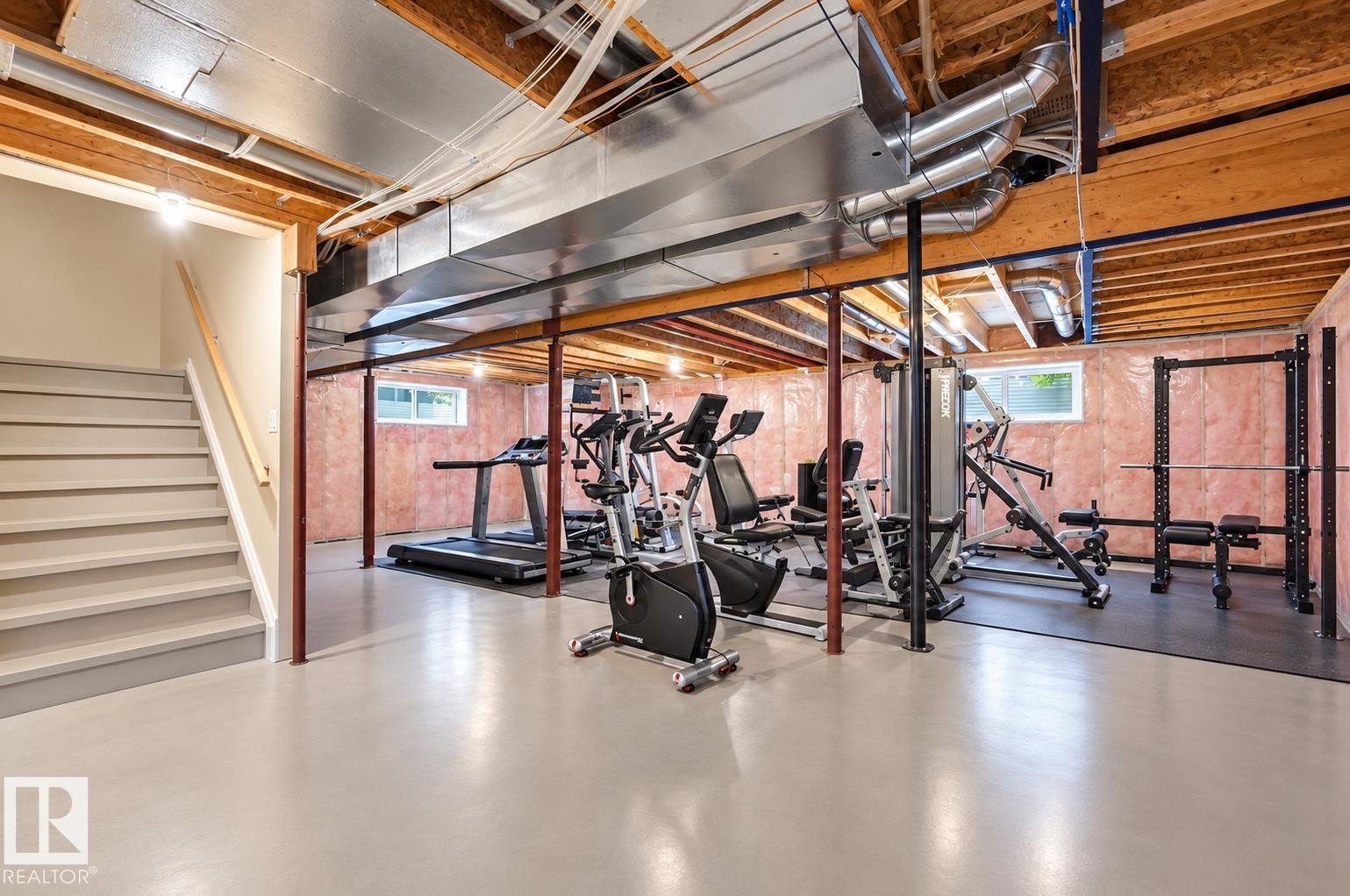 Full and open with lots of natural light. Painted floors make a terrific work out space or play area for the kids. - 1406 Thorogood Lane Nw, Edmonton, AB