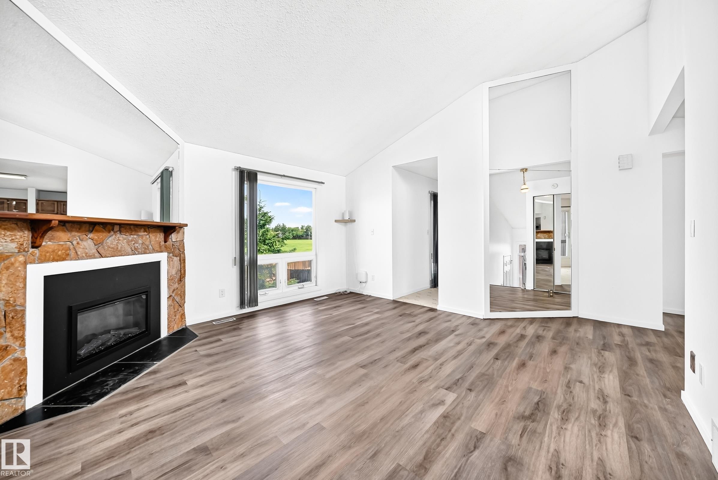 14141 26 Street Nw, Edmonton, AB - Indoor Photo Showing Living Room With Fireplace
