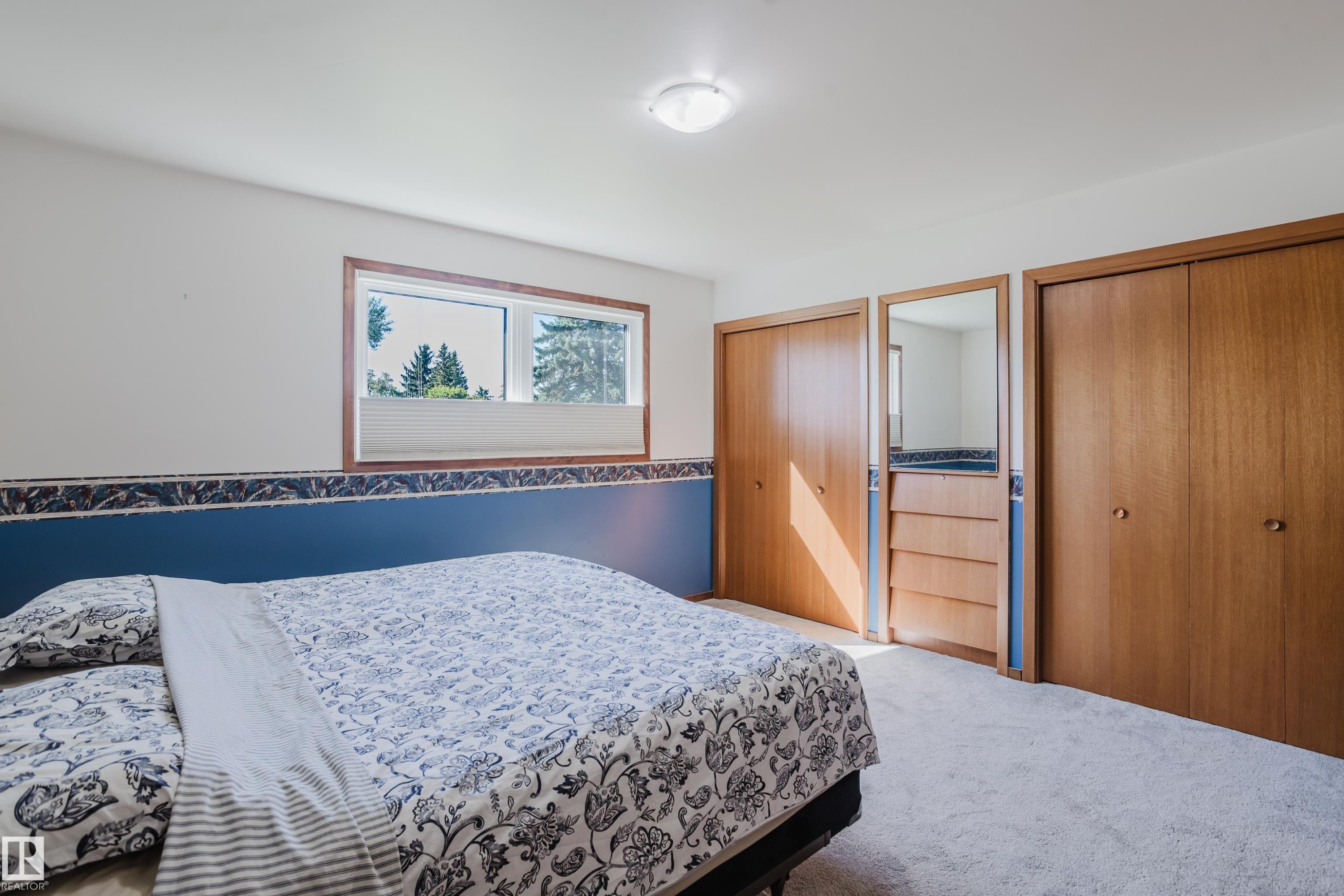 Wall-to-wall carpeting and wood-finish closet doors - 10924 35A Avenue Nw, Edmonton, AB