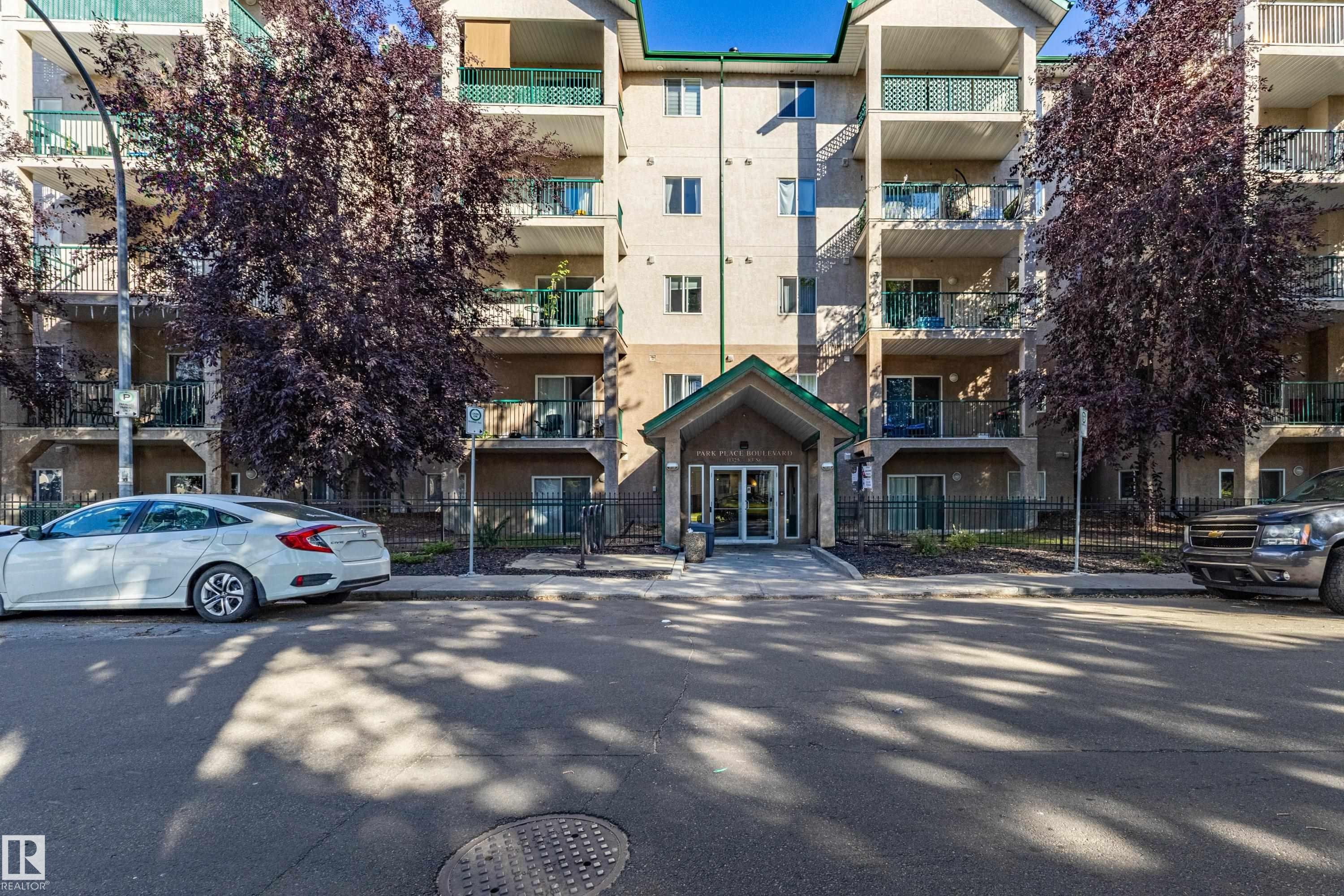 Multi-story residential building with private balconies and a covered entrance - #316 11325 83 St Nw, Edmonton, AB