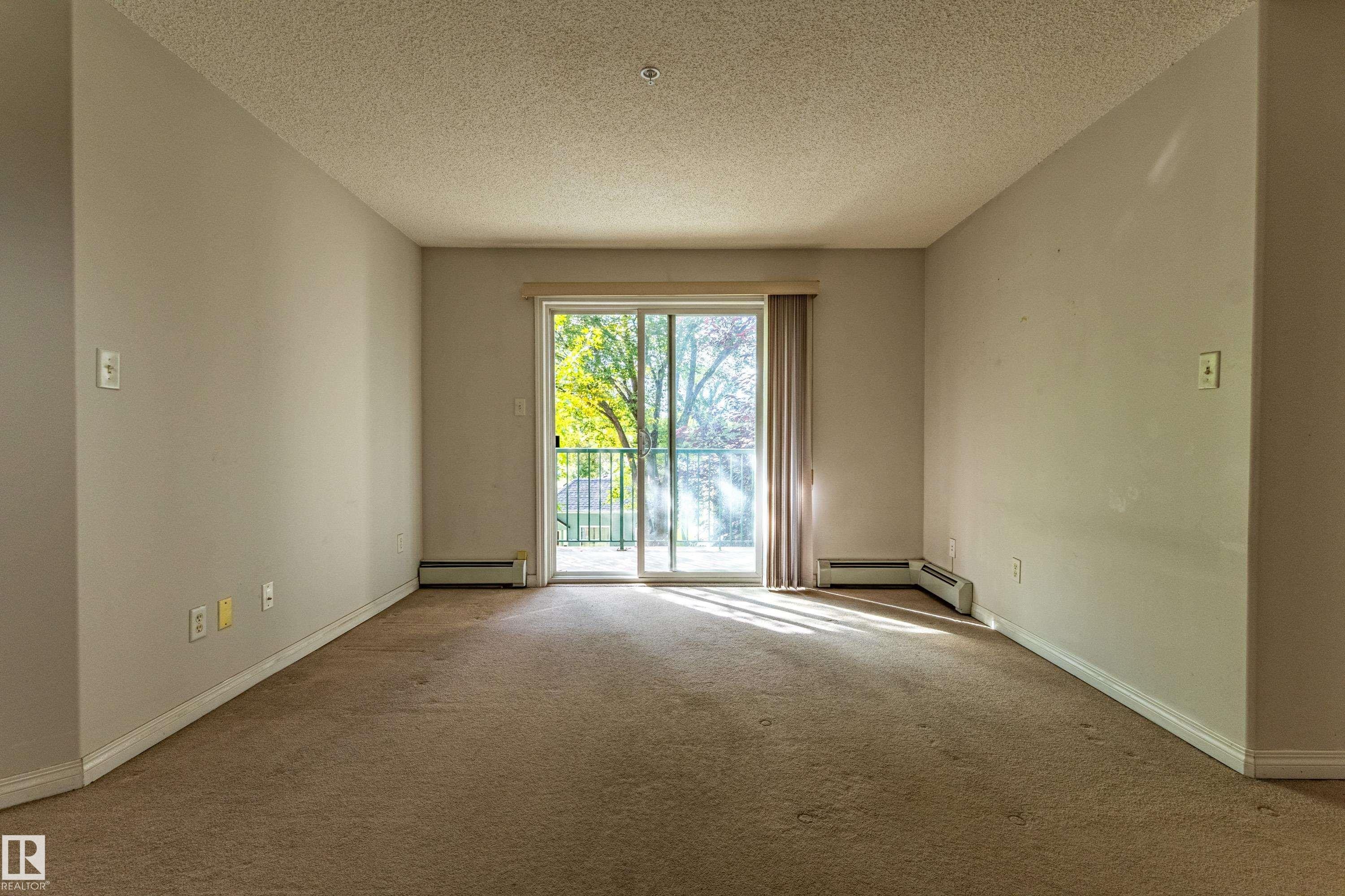 Wall-to-wall carpeting and neutral wall tones - #316 11325 83 St Nw, Edmonton, AB