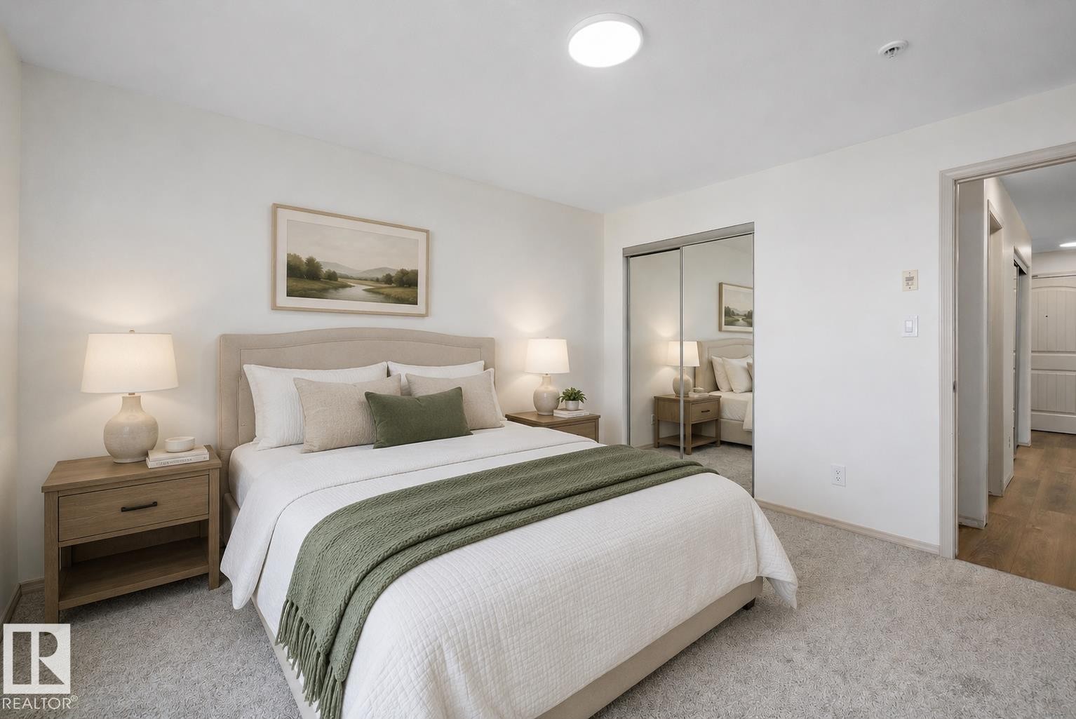 Carpeted bedroom featuring a neutral upholstered headboard (virtually staged) - #353 2096 Blackmud Creek Dr Sw, Edmonton, AB - Indoor Photo Showing Bedroom