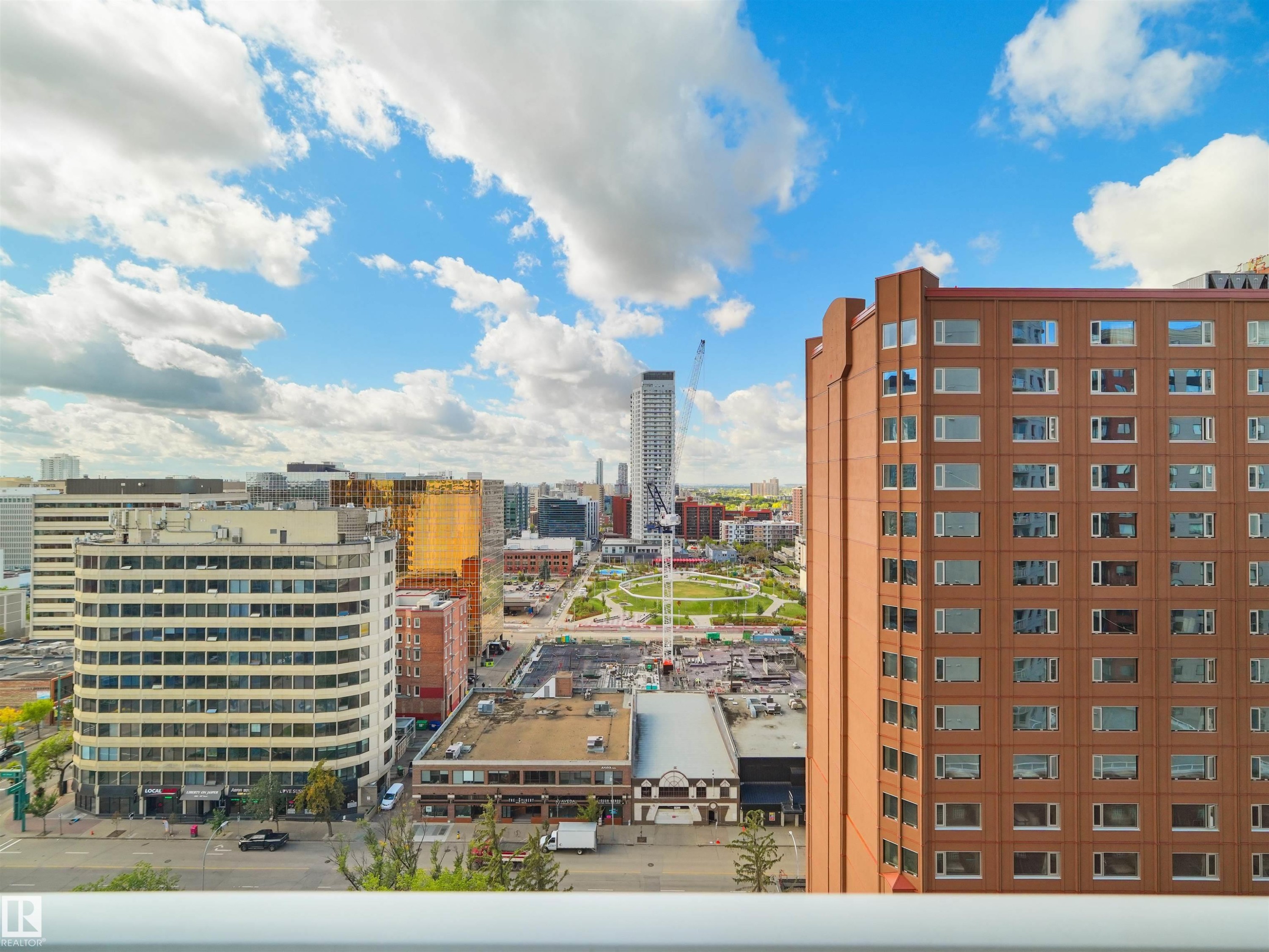 Cityscape with diverse architectural styles, including a prominent high-rise structure - #1601 10136 104 St Nw, Edmonton, AB