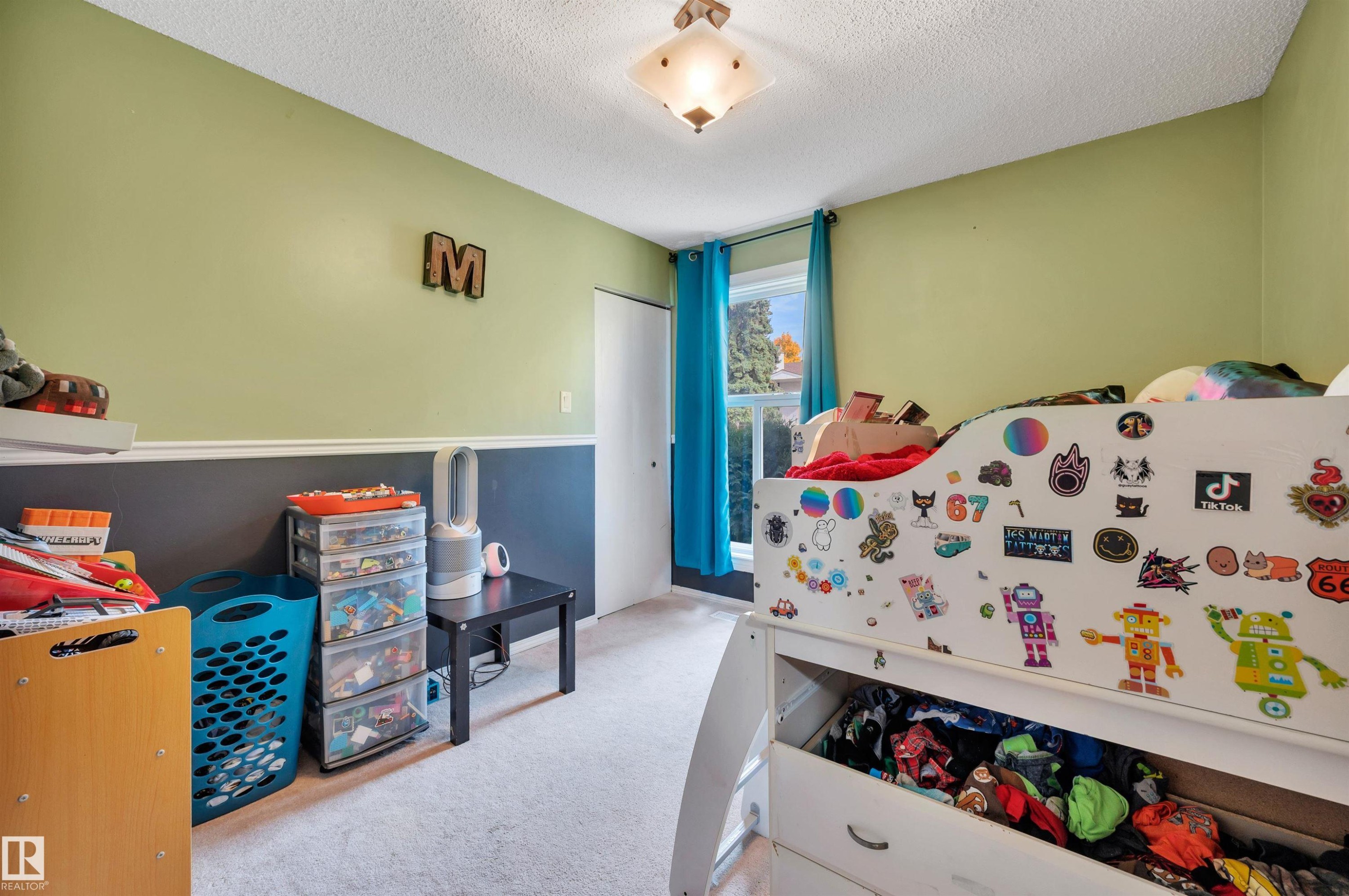 Recessed lighting with a frosted glass fixture, textured ceiling, and carpeted flooring - 15017 26 Street Nw, Edmonton, AB
