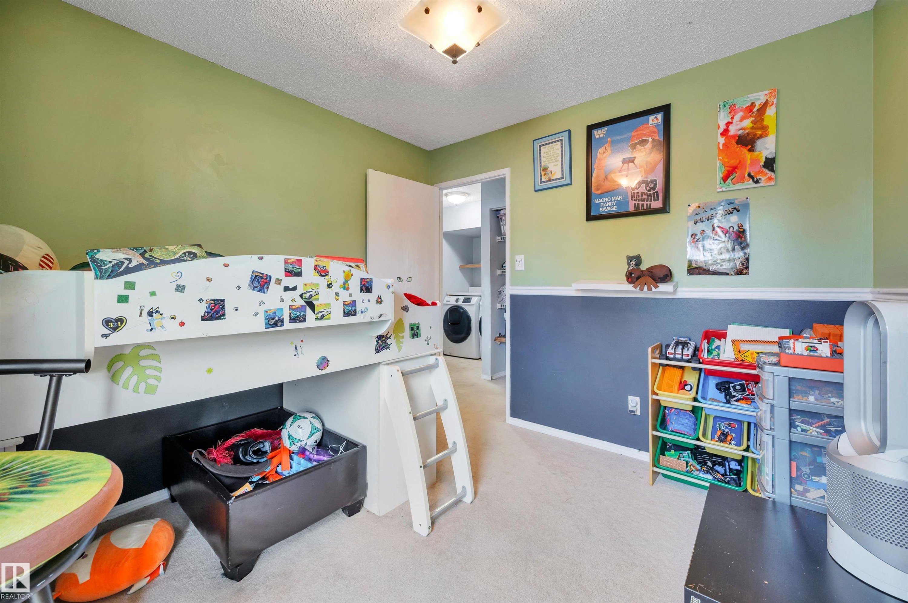 Carpeted flooring, two-tone wall with chair rail, and ceiling light fixture - 15017 26 Street Nw, Edmonton, AB