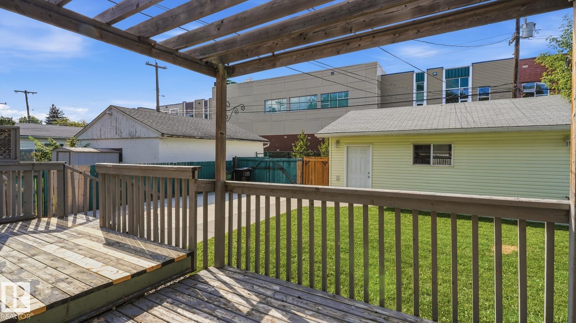 Wood-decked patio with a pergola structure - 11836 62 Street Nw, Edmonton, AB