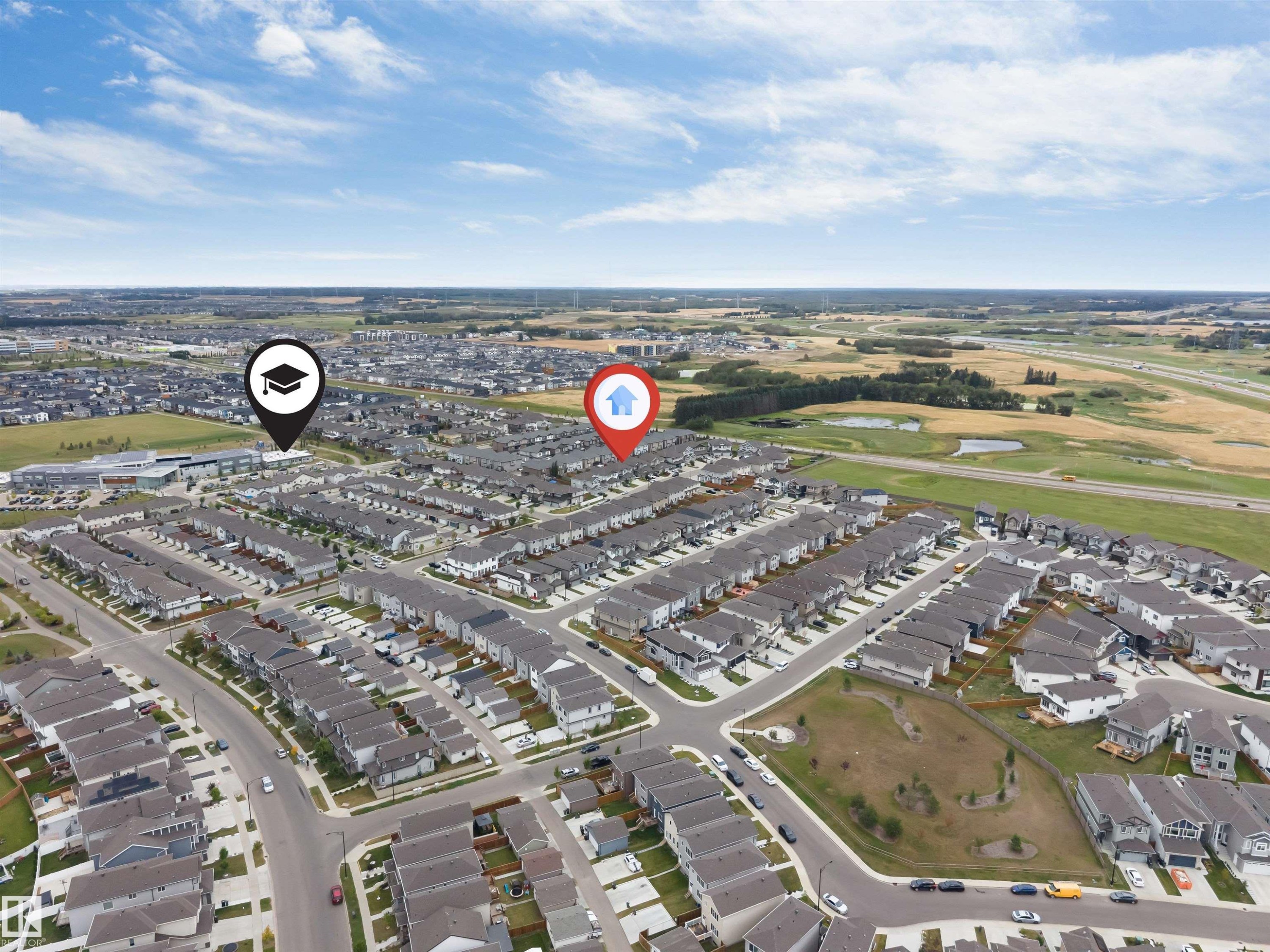 Aerial perspective of a developed residential neighborhood with nearby green spaces and a commercial area - 2004 15 Avenue Nw, Edmonton, AB