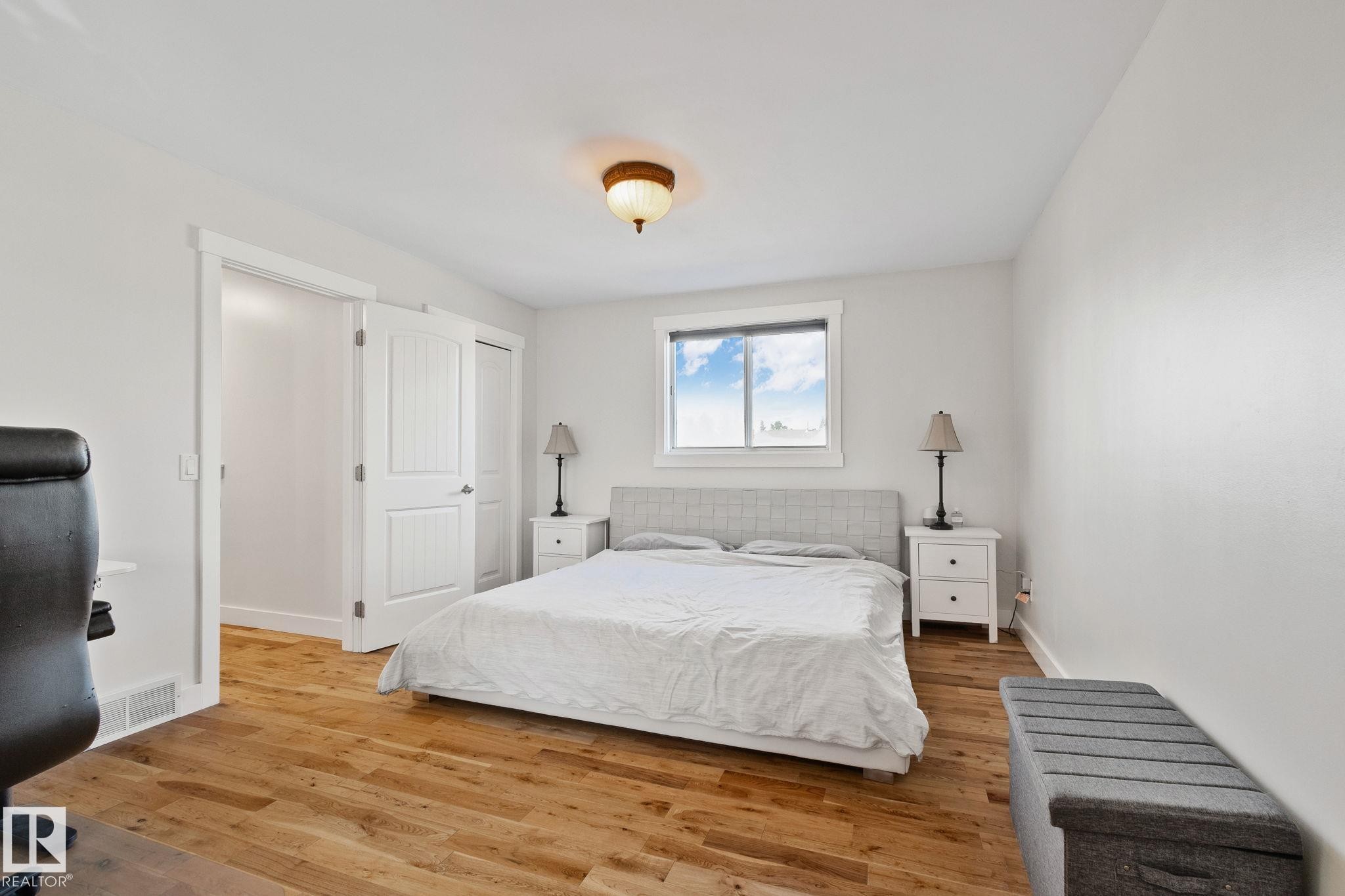 Wood-finish flooring, white trim, recessed window, and overhead lighting - 12403 29A Avenue Nw, Edmonton, AB