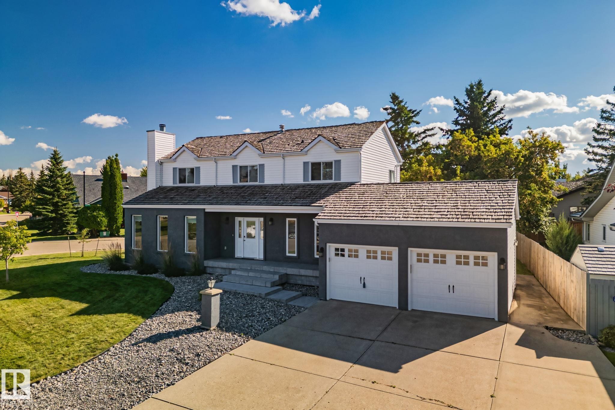Two-story residence featuring a white and dark gray exterior with shingle roofing - 12403 29A Avenue Nw, Edmonton, AB