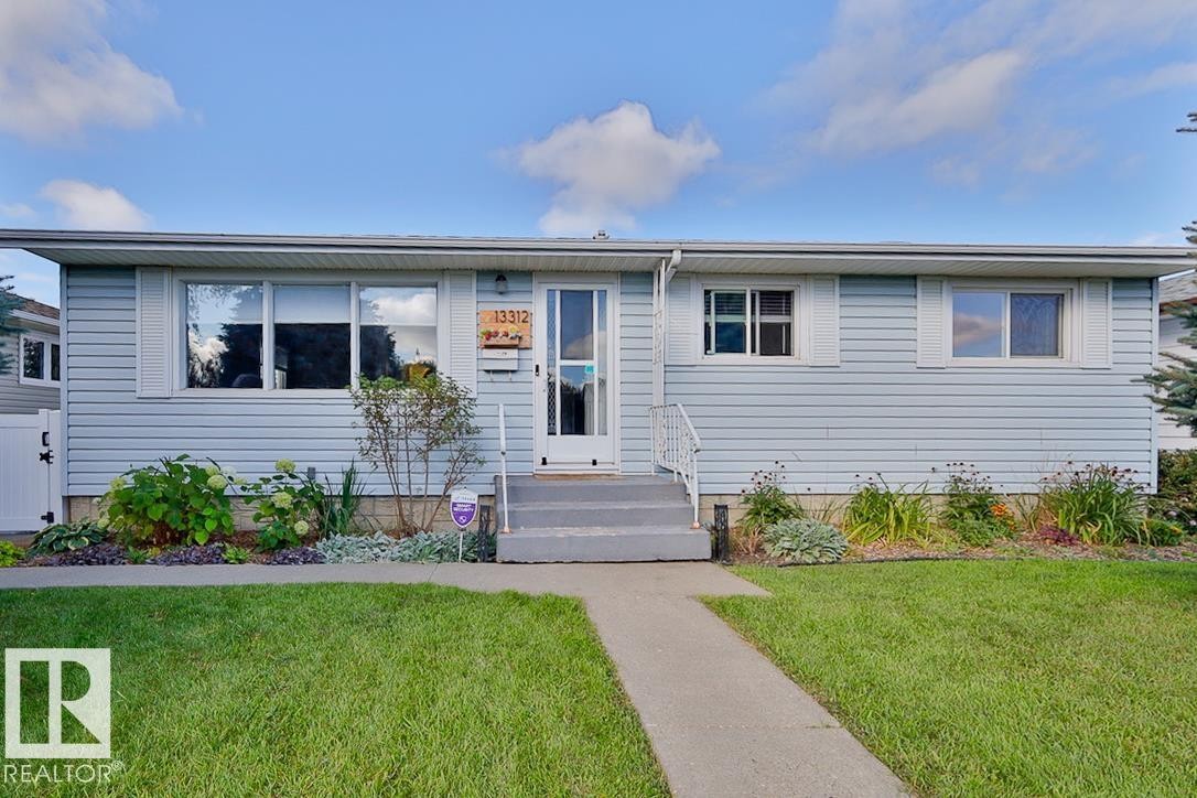 Light blue siding exterior with white trim windows and a white front door - 13312 123A Street Nw, Edmonton, AB