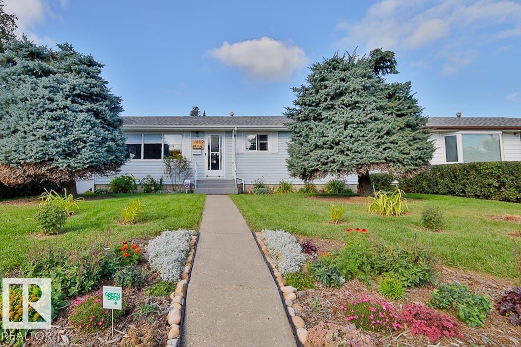 Light blue siding exterior with a dark shingle roof - 13312 123A Street Nw, Edmonton, AB
